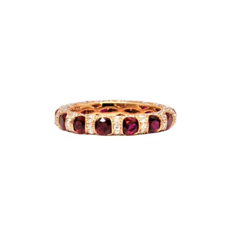 This beautiful ruby and diamond eternity band features 14 natural rubies weighing 2.32 ct and 154 natural diamonds weighing 1.19 ct. This beauty is set in 18k rose gold, and is an amazing addition to any wardrobe. 


