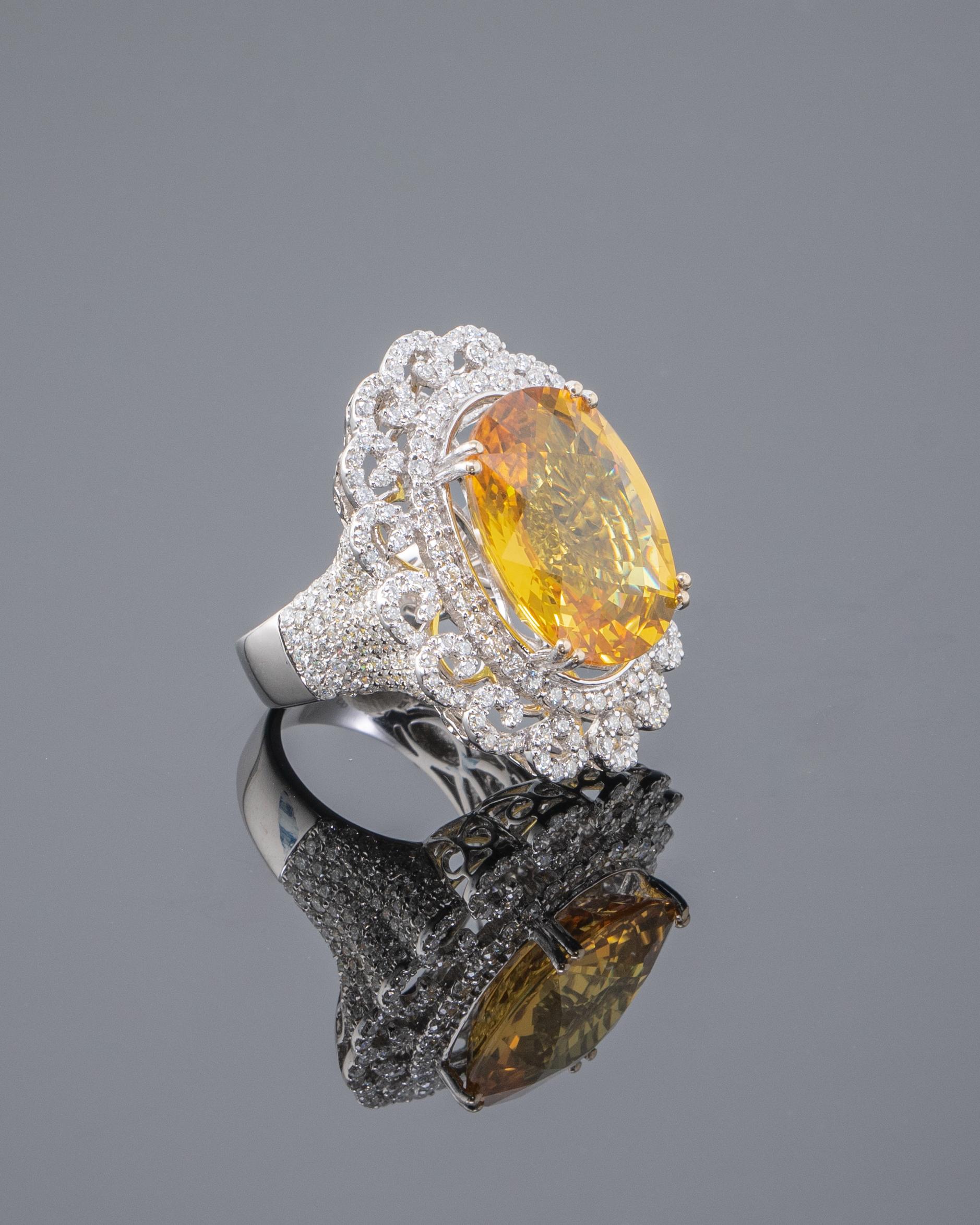 Make a statement with this gorgeous 23.21 carat Yellow Sapphire and 3.29 carat White Diamond cocktail ring, set in 12.80 grams of solid 18K White Gold. The sapphire is eye clean, no inlcusions and has great lustre and a beautiful yellow colour. It