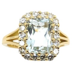 2.32ct Natural Aquamarine Ring Surrounded by 0.55ct Diamonds in 18ct Gold