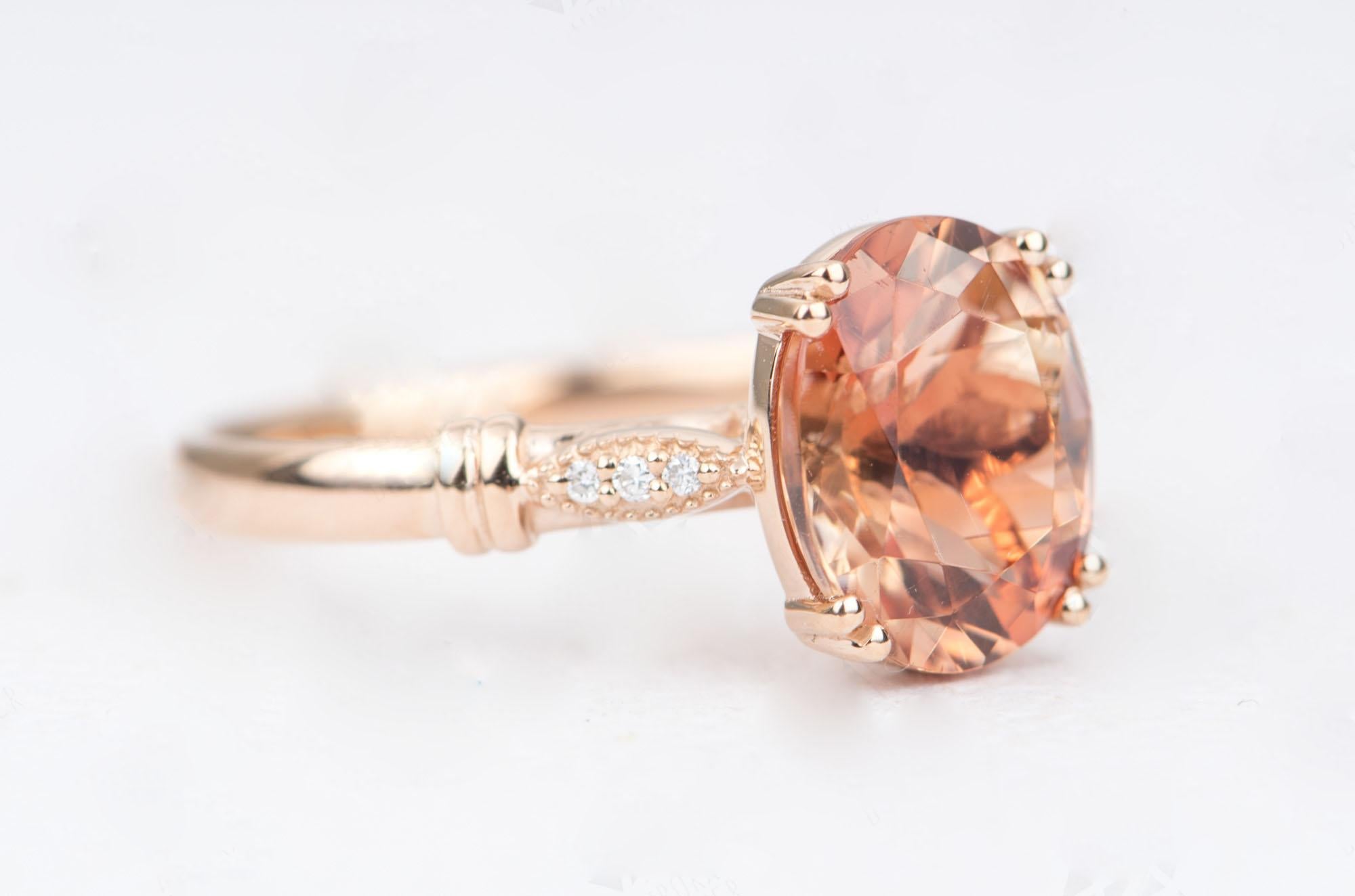 ♥  This is a beautiful vintage-inspired 14k rose gold ring featuring an Oregon sunstone in the center, flanked by a trio of white diamonds in a marquise setting on each side of the shank. 
 ♥  The sunstone center picks up a deep orange color with