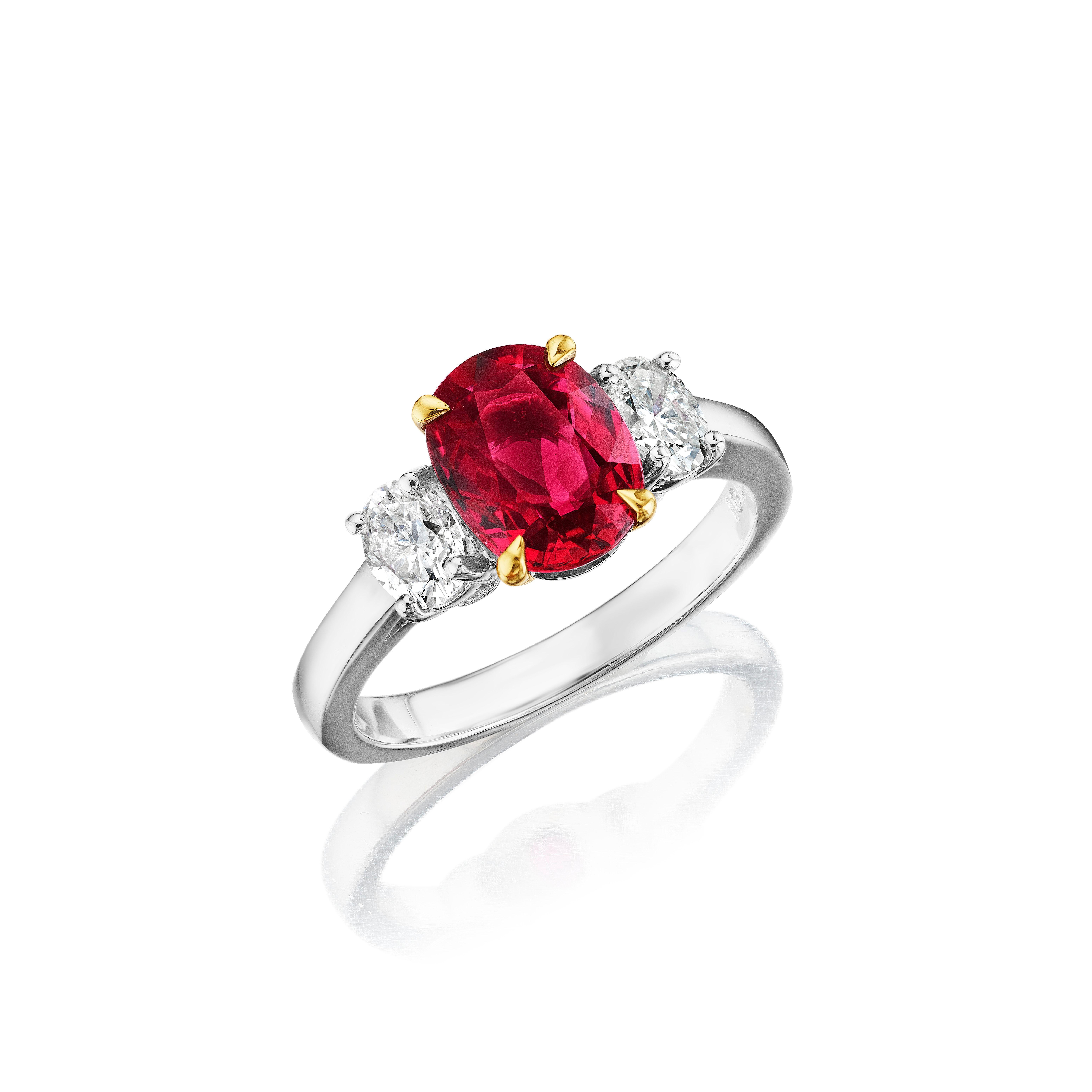 •	18KT Two Tone
•	Size 6.5
•	2.96 Carats

•	Number of Oval Rubies: 1
•	Carat Weight: 2.32ctw

•	Number of Oval Diamonds: 2
•	Carat Weight: 0.64ctw

•	This one of a kind ring holds a beautiful 2.32 carat oval cut red ruby in the center, set between 2
