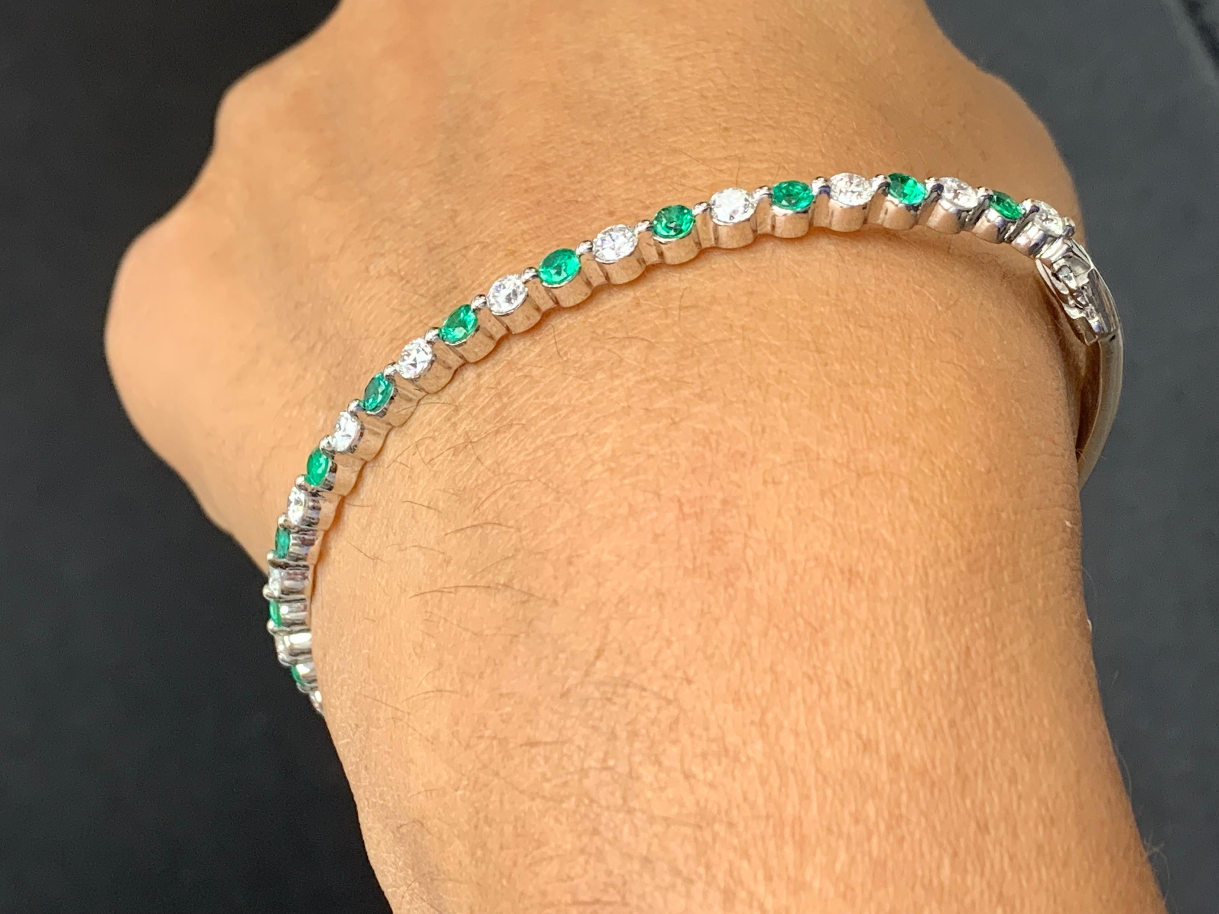 Brilliant Cut 2.33 Carat Emerald and Diamond Bangle Bracelet in 14 K White Gold For Sale