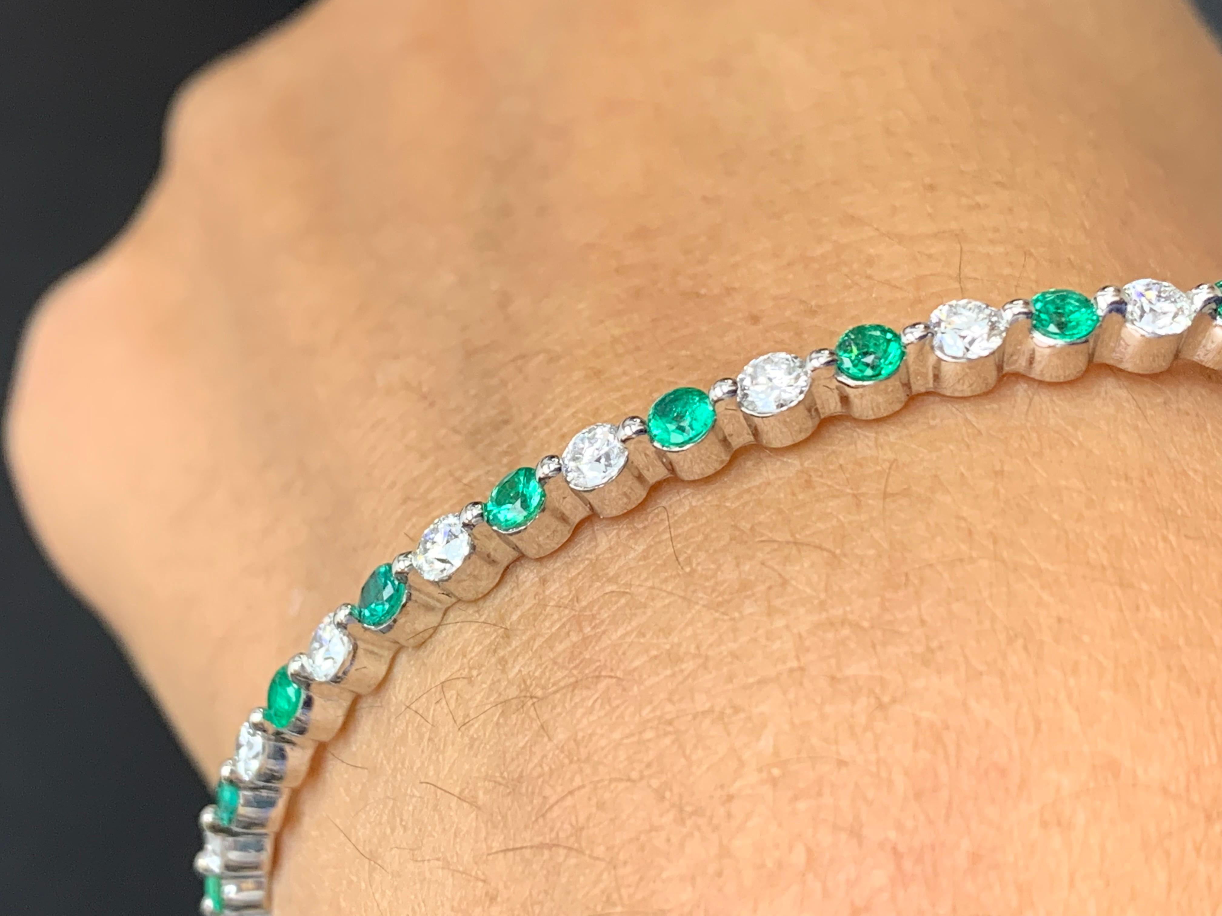 Women's 2.33 Carat Emerald and Diamond Bangle Bracelet in 14 K White Gold For Sale