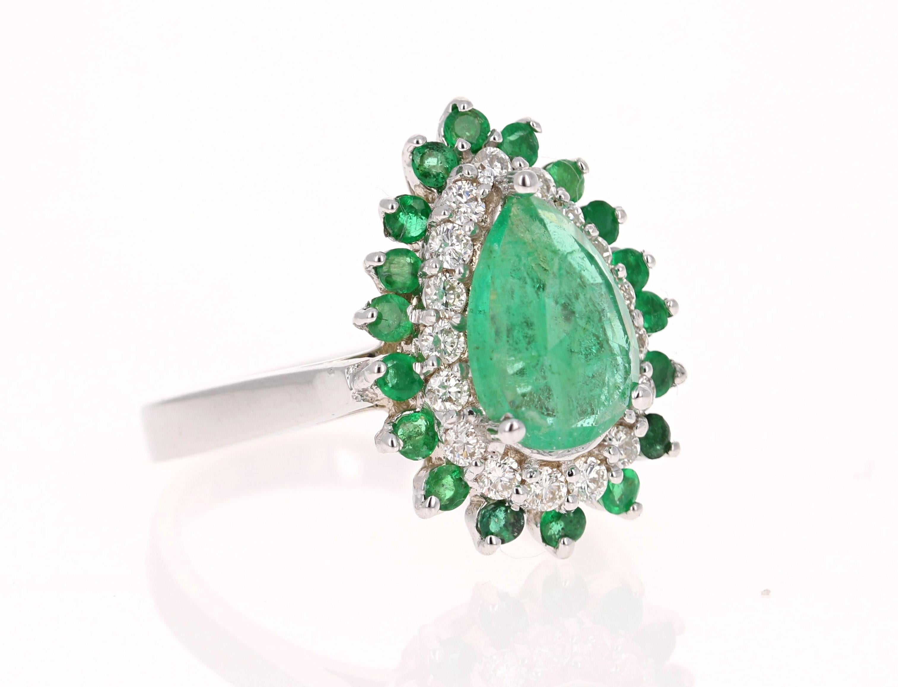 This Pear Cut Emerald ring has a 1.46 Carat Natural Emerald that measures at 7 mm x 9 mm. 
It is further embellished with 18 Emeralds that weigh 0.47 Carats and 18 Round Cut Diamonds that weigh 0.40 Carats. The total carat weight of the ring is 2.33
