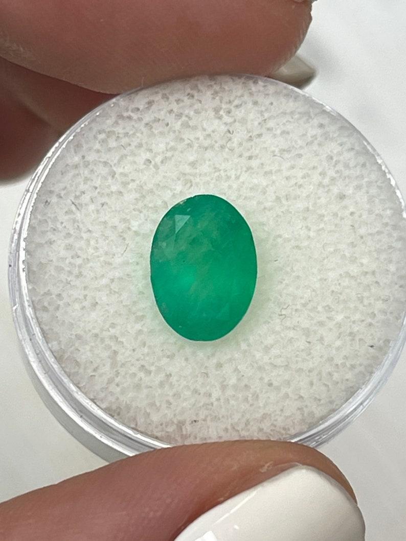 Stone: Emerald
Weight: 2.33-carats
Shape: Oval Cut
Clarity: Semi-Transparent
Luster: Good
Color: Medium Green
Measurements: 10.20mm x 7.49mm x 5.44mm
Geographic Origin: Colombia
Treatment: Natural, Oiling

Comments: Due to their growth conditions in