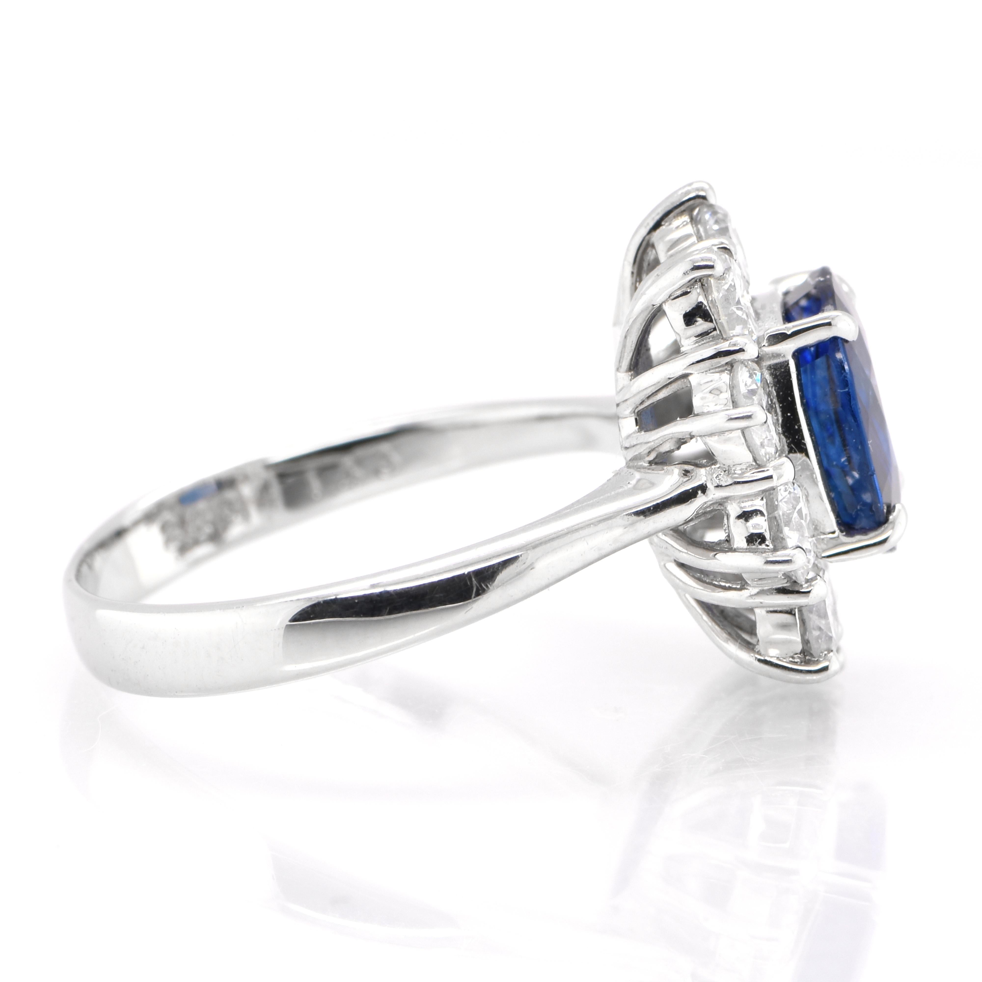 Modern 2.33 Carat Natural Sapphire and Diamond Halo Ring Set in Platinum