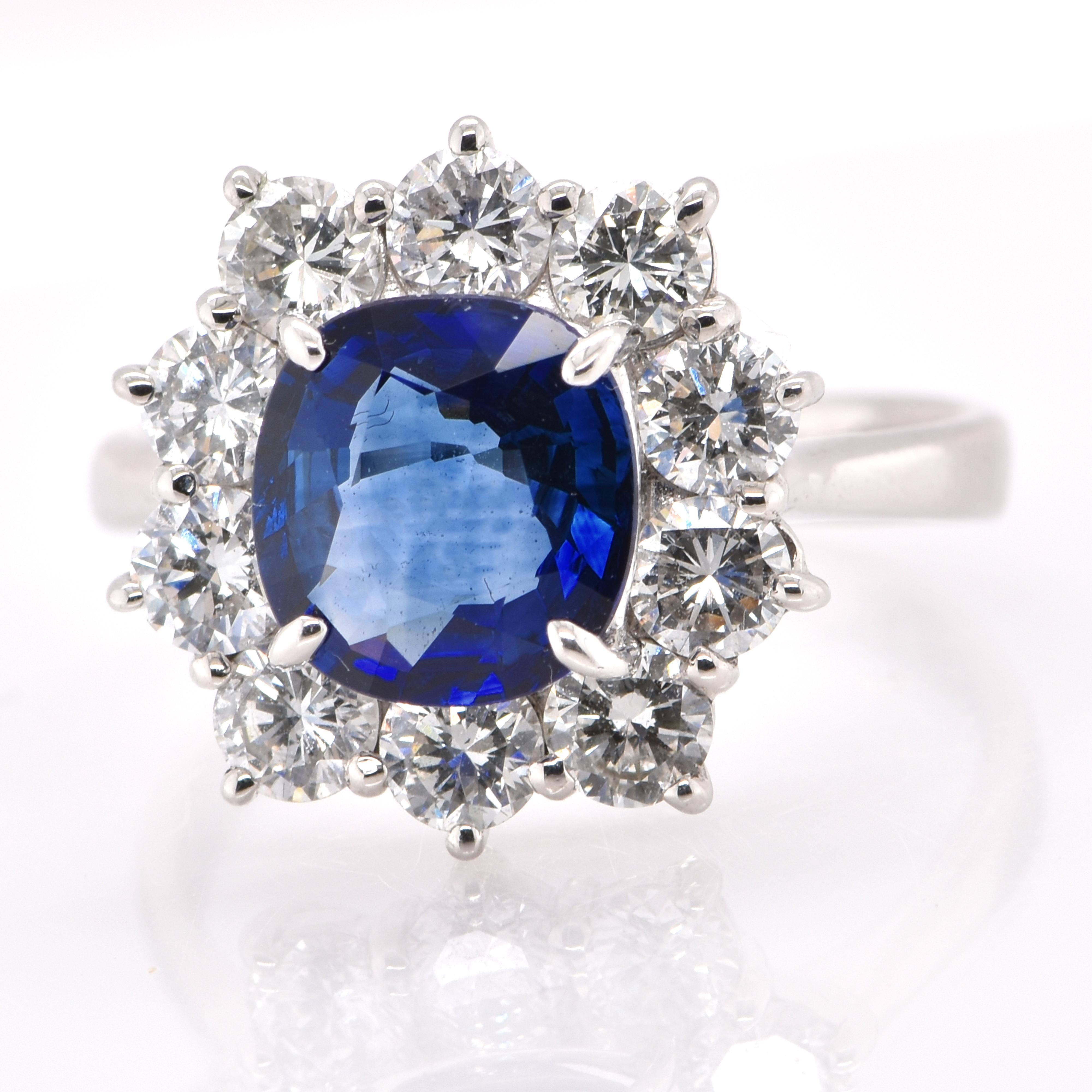 Oval Cut 2.33 Carat Natural Sapphire and Diamond Halo Ring Set in Platinum