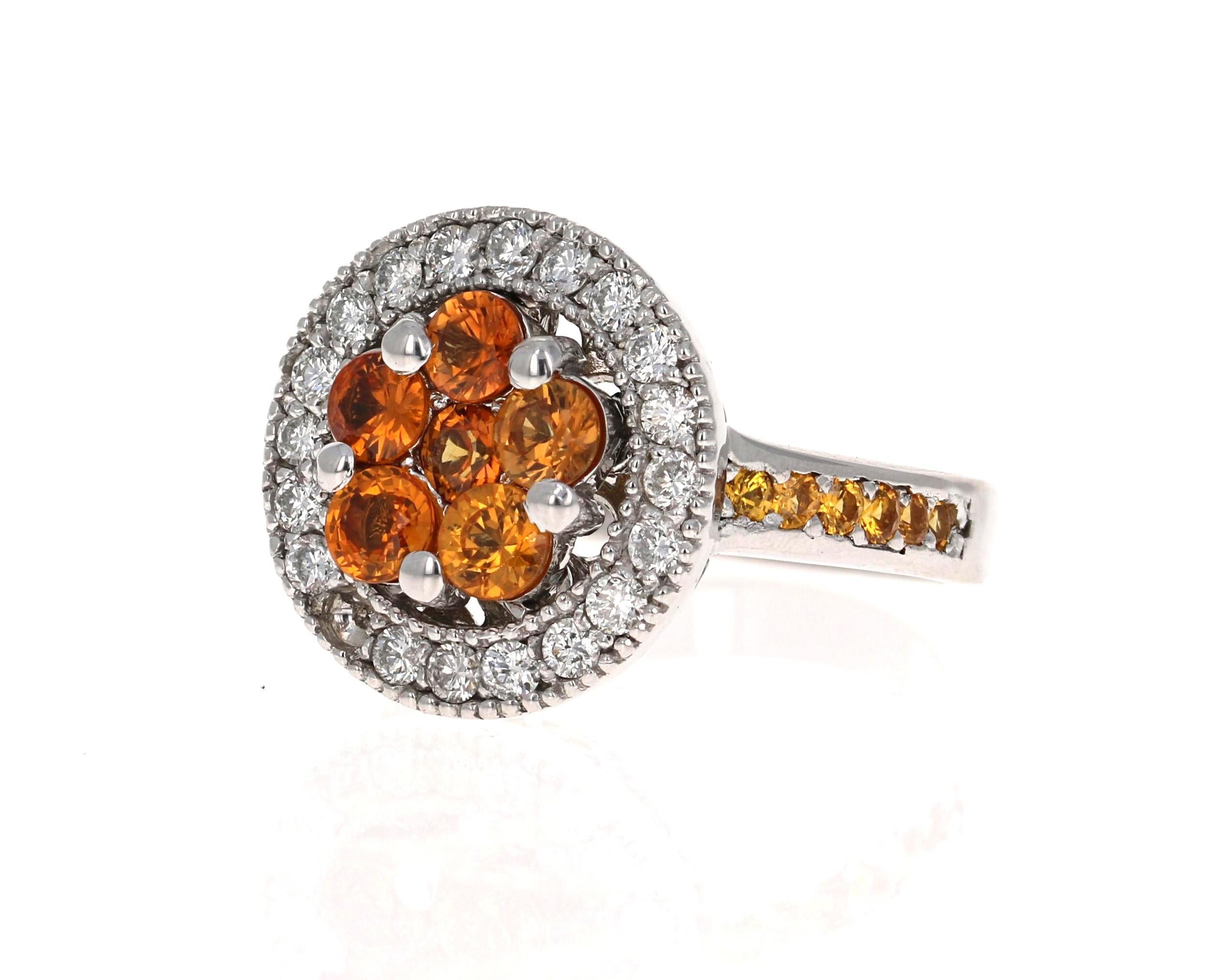 2.33 Carat Orange Sapphire Diamond White Gold Cocktail Ring

This ring has a cluster of 6 Orange Sapphires that weigh 1.45 Carats and 20 Round Cut Diamonds that weigh 0.51 carats Clarity: SI2, Color: F). Along the shank are 12 Yellow Sapphires that