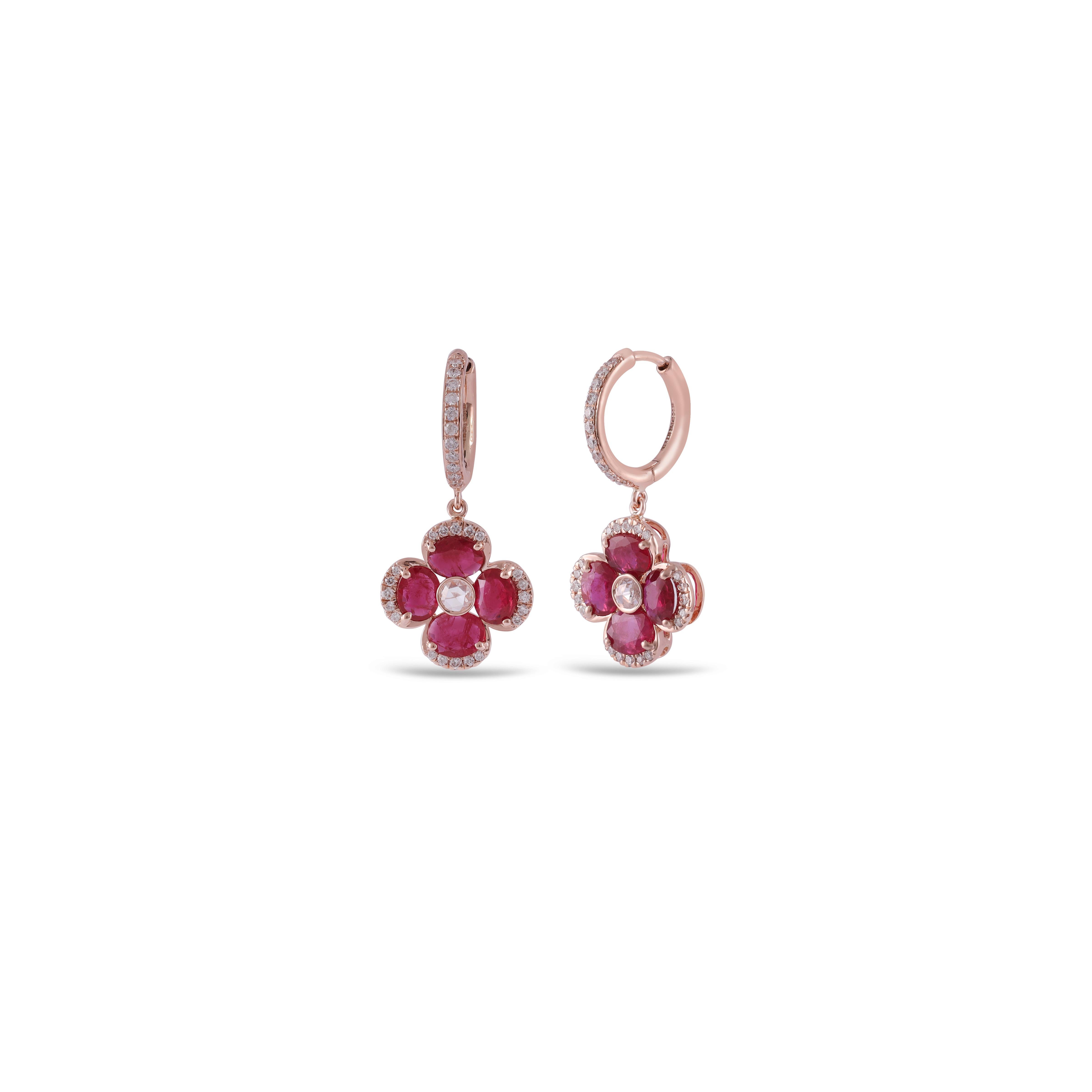 If you are looking for Ruby earrings, this is the ultimate find, (2.33 carats) of the finest Ruby color is the focal point. Perfectly matched in color, size, and transparency. The color is what you want . The diamonds  surrounding the gorgeous