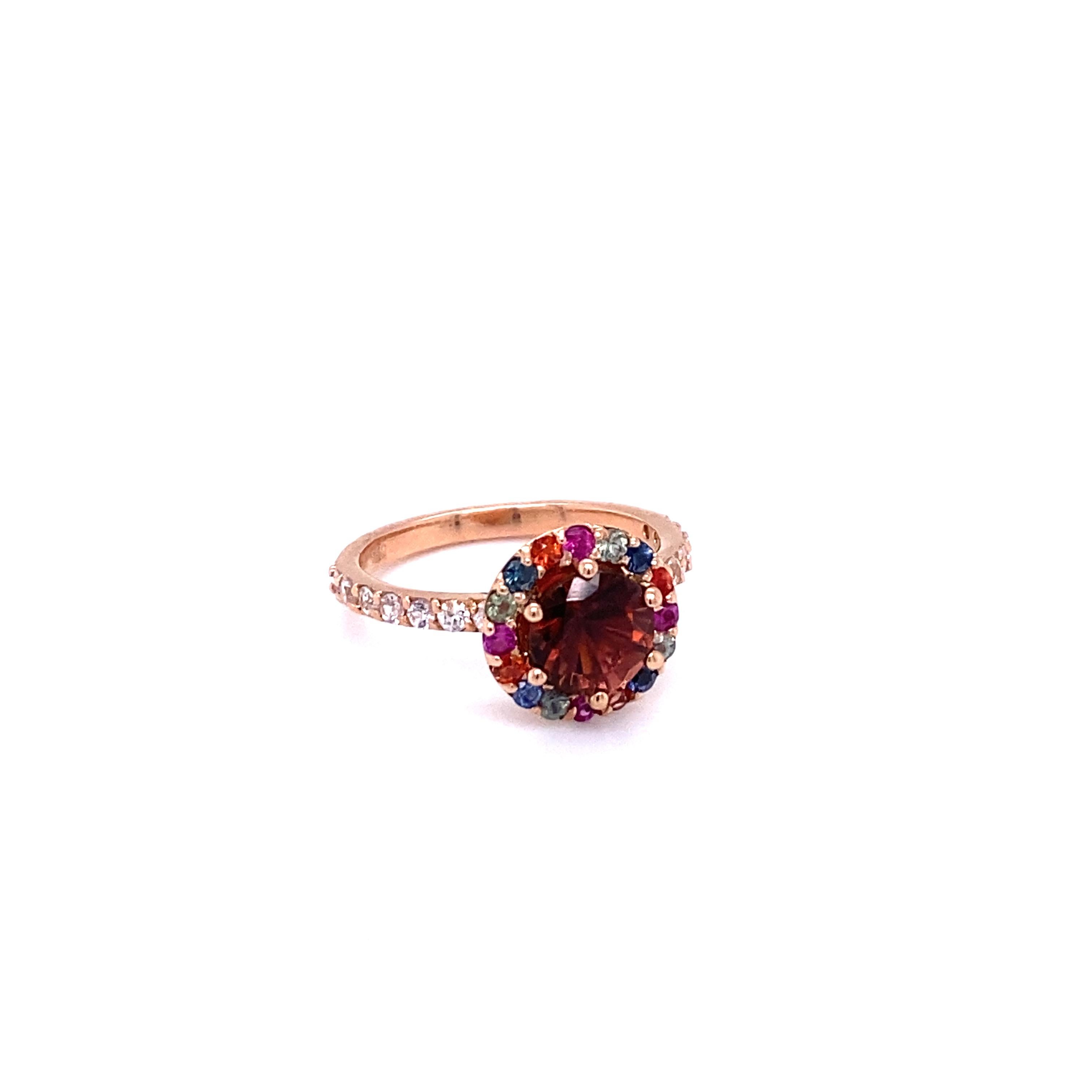 2.33 Carat Tourmaline Sapphire Rose Gold Cocktail Ring

This ring has a 1.43 carat Round Cut Tourmaline that is set in the center of the ring and is surrounded by 16 Multi-Sapphires that weigh 0.48 carats and 14 White Sapphires along the shank of