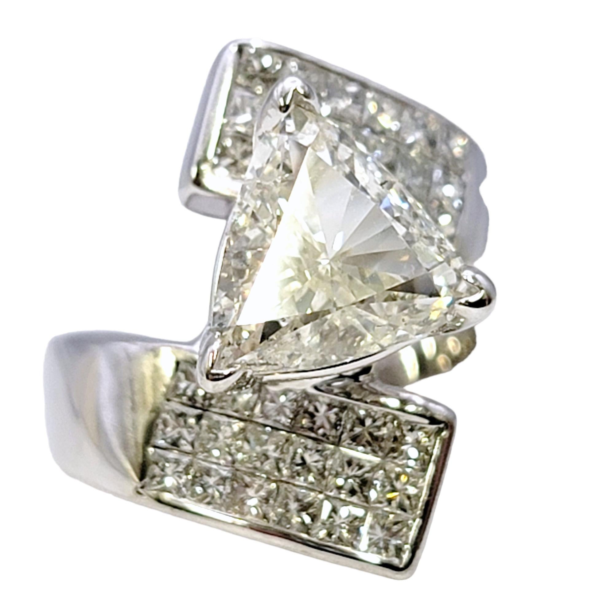 Ring size: 6

This is not your ordinary engagement or statement ring! This bold, contemporary style diamond ring is absolutely bursting with sparkle. The striking ring features an impressive trillion cut center stone set in a high profile setting.