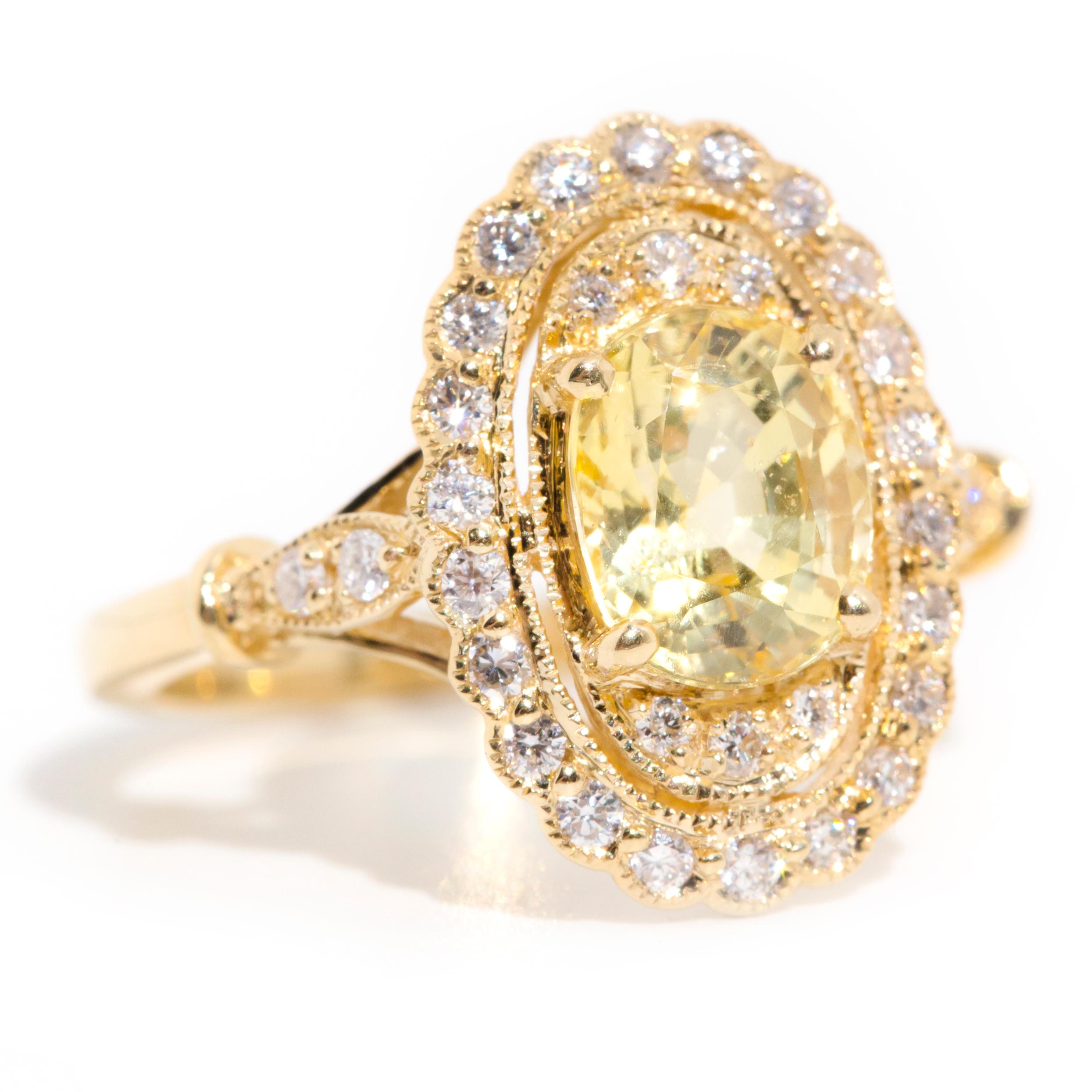 Contemporary 2.33 Carat Yellow Ceylon Sapphire and Diamond Halo Ring in 18 Carat Yellow Gold  For Sale