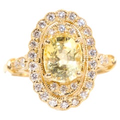 2.33 Carat Yellow Ceylon Sapphire and Diamond Halo Ring in 18 Carat Yellow Gold 