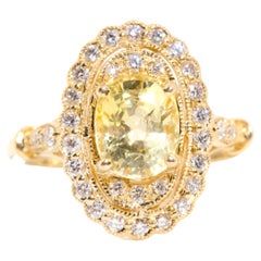 Antique 2.33 Carat Yellow Ceylon Sapphire and Diamond Halo Ring in 18 Carat Yellow Gold 