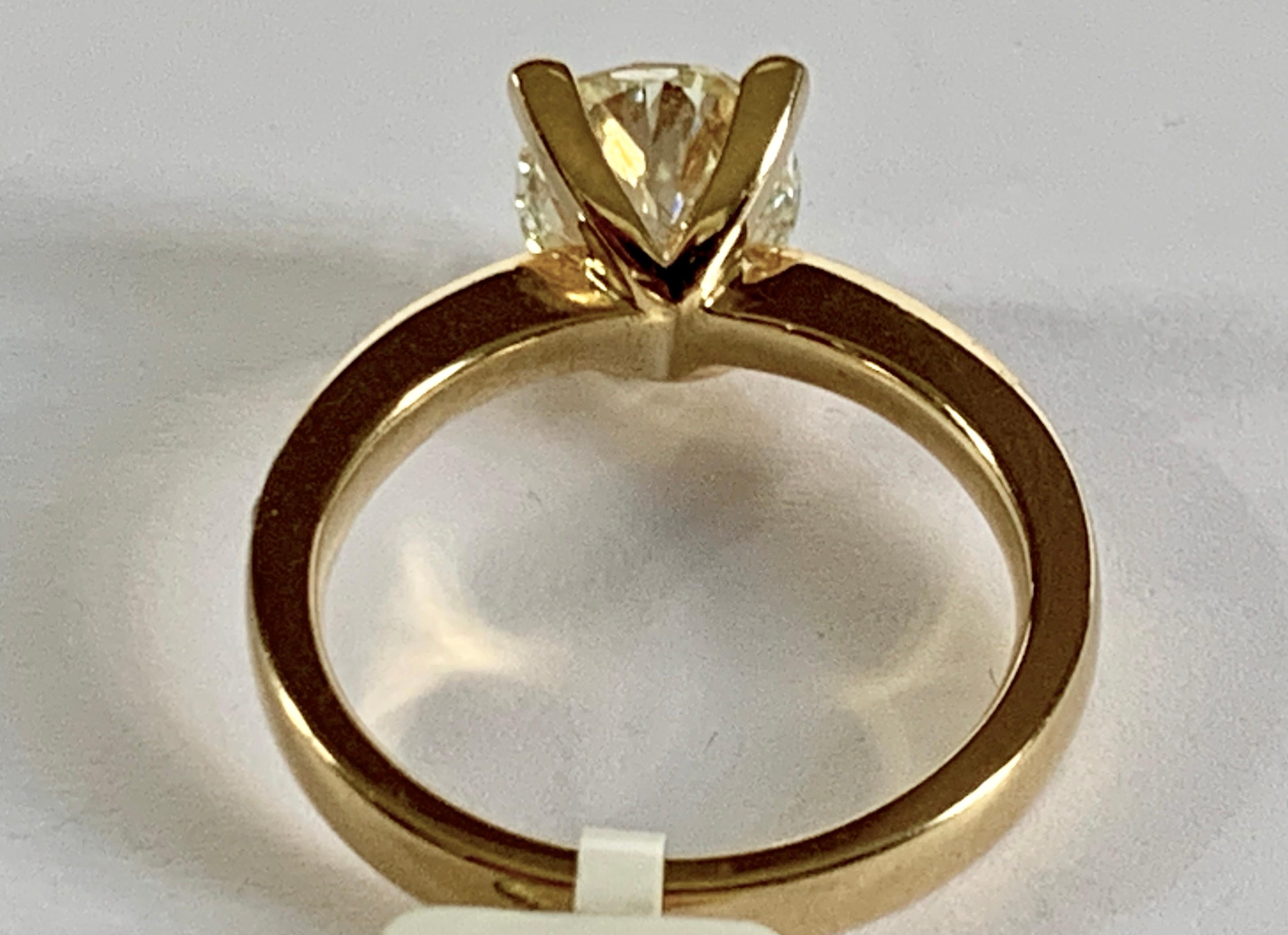 Contemporary 2.33 Carat Oval Yellow Diamond Solitaire Ring For Sale