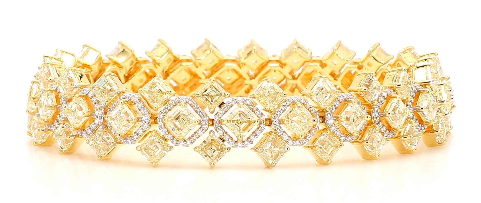 This exquisite Yellow Bracelet is a true masterpiece. It features a stunning Fancy Yellow Diamond weighing an astonishing 23.30 carats. The vibrant yellow hue of this diamond is captivating and elevates the beauty of the entire piece.

Surrounding