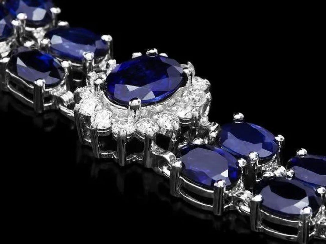 23.30 Natural Blue Sapphire and Diamond 14K Solid White Gold Bracelet

Total Natural Sapphire Weight is: Approx. 21.90 carats 

Sapphires Measure: Approx. 6x4 - 8x6 mm

Sapphire Treatment: Diffusion

Total Natural Round Diamonds Weight: Approx. 1.40
