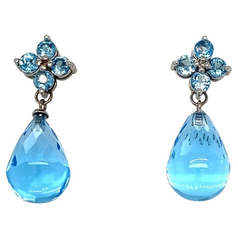 23.31 Carat Blue Topaz White Gold Drop Earrings

Item Specs:

2 Faceted Briolette Blue Topaz stones weighing approximately 22.05 carats
(Measurements of Blue Topaz Faceted Briolette 15mm x 10mm) 
8 Round Cut Blue Topaz weighing approximately 1.26