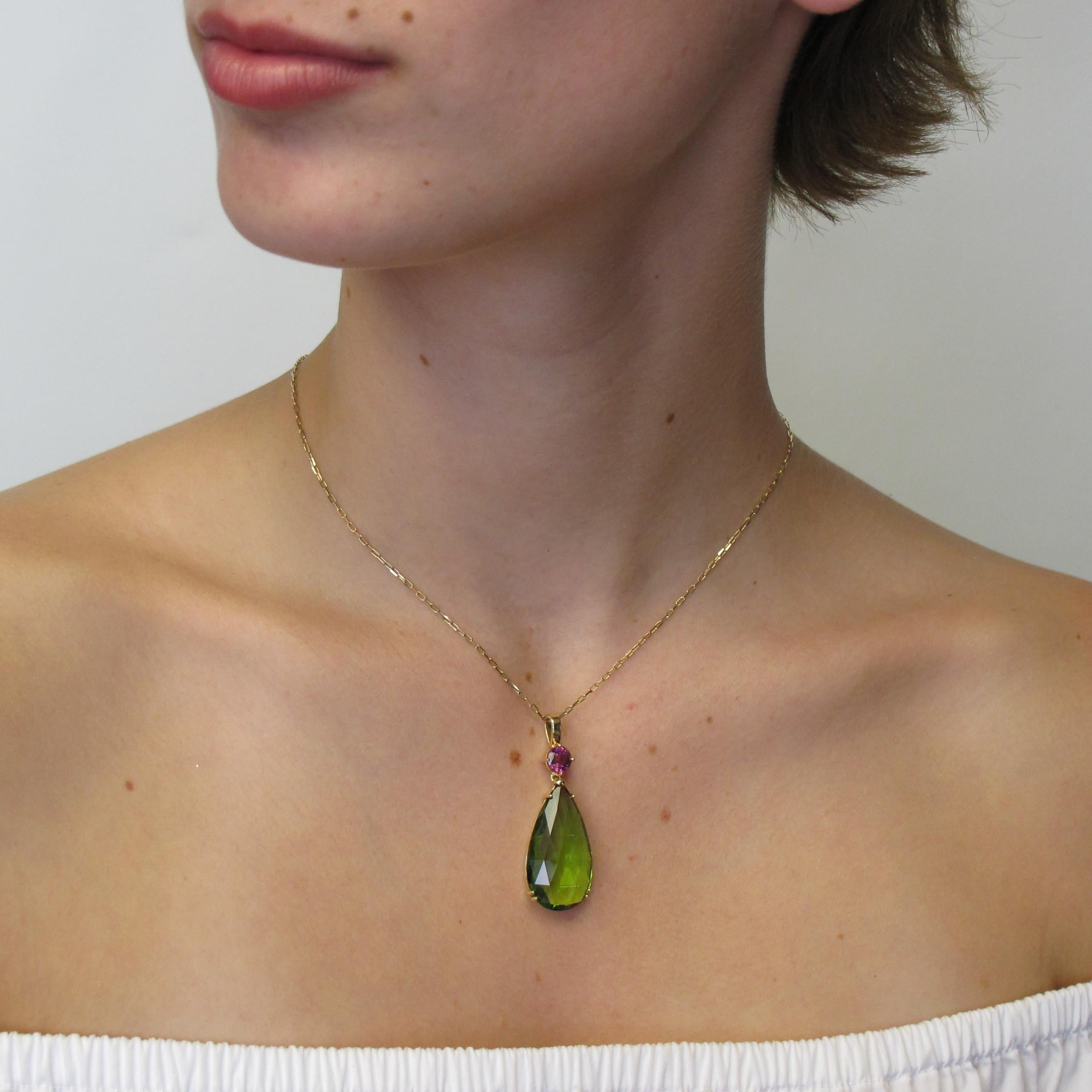 This enchanting pear shaped pendant necklace will turn heads wherever you choose to wear it. A versatile piece that gives you the option to dress it up or down. This pendaloque cut peridot 30x15mm (23.33 carats) pendant is set with 1 round mulberry