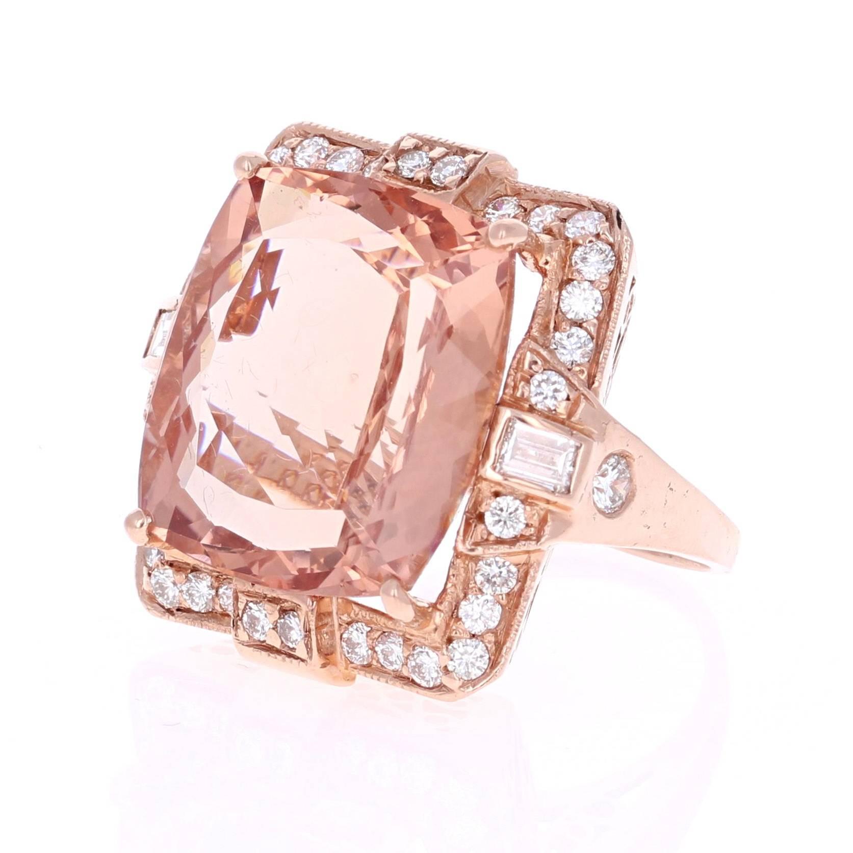 A gorgeous and unique cocktail ring that is sure to stir up some real conversation at the next party! This ring has a huge 22.10 carat Morganite in the center of the ring and is surrounded by 34 Round Cut Diamonds that weigh 1.04 carats (Clarity: