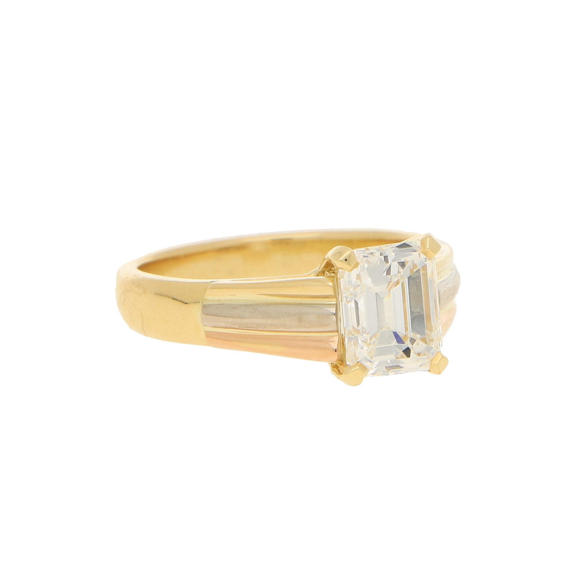 A beautiful certified emerald cut diamond solitaire engagement ring set in 18k yellow, rose and white gold.

The piece is predominantly set with a lovely 2.07 carat certified emerald cut diamond, which is securely four claw set to center. To either
