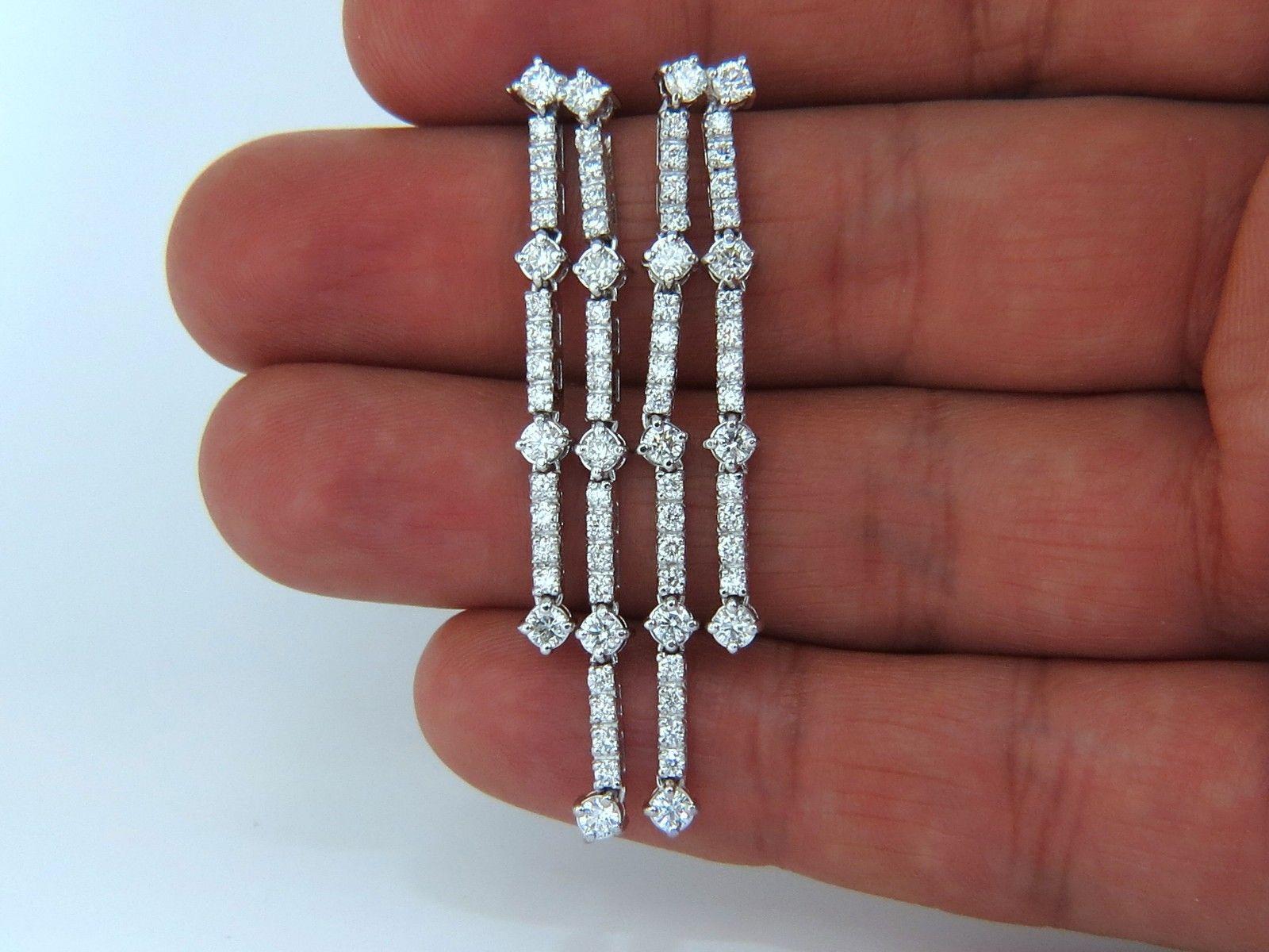 Two Rowed, Five Tiered Dangles

2.33ct. Natural diamonds  earrings.

Rounds, Full cut brilliants.

G- color Vs-2 Clarity. 

Excellent detail.

14kt. white gold

7.9 grams.

Butterfly, Comfortable push backs 

$8,000 Appraisal Certificate will