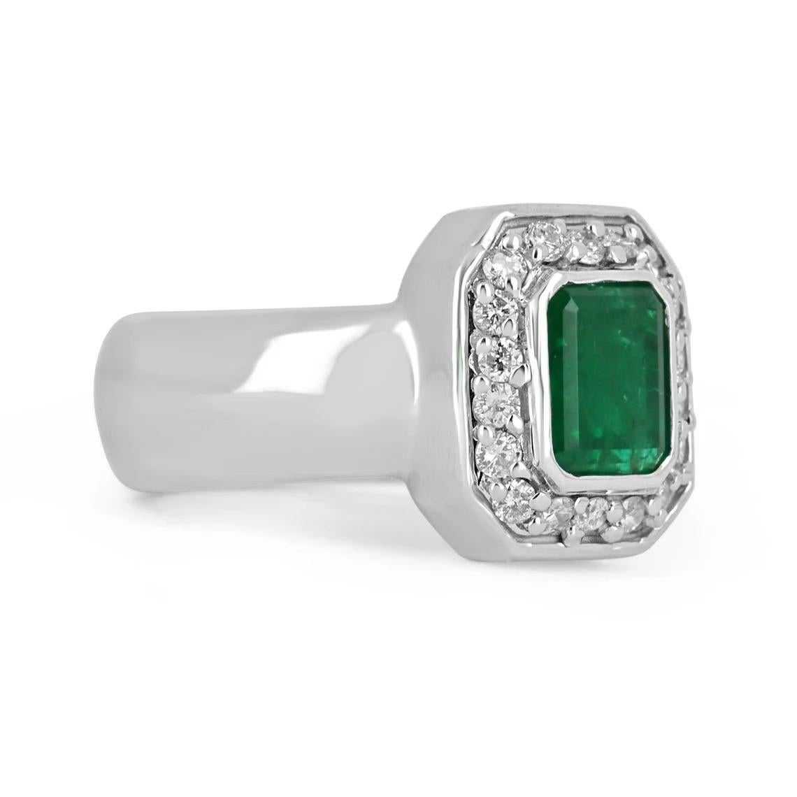 Elegance and sophistication are what this gorgeous emerald and diamond ring is all about. The emerald is almost a full two carats, bezel-set, and accented by brilliant round diamonds creating a gorgeous halo around the center stone; set in a modern