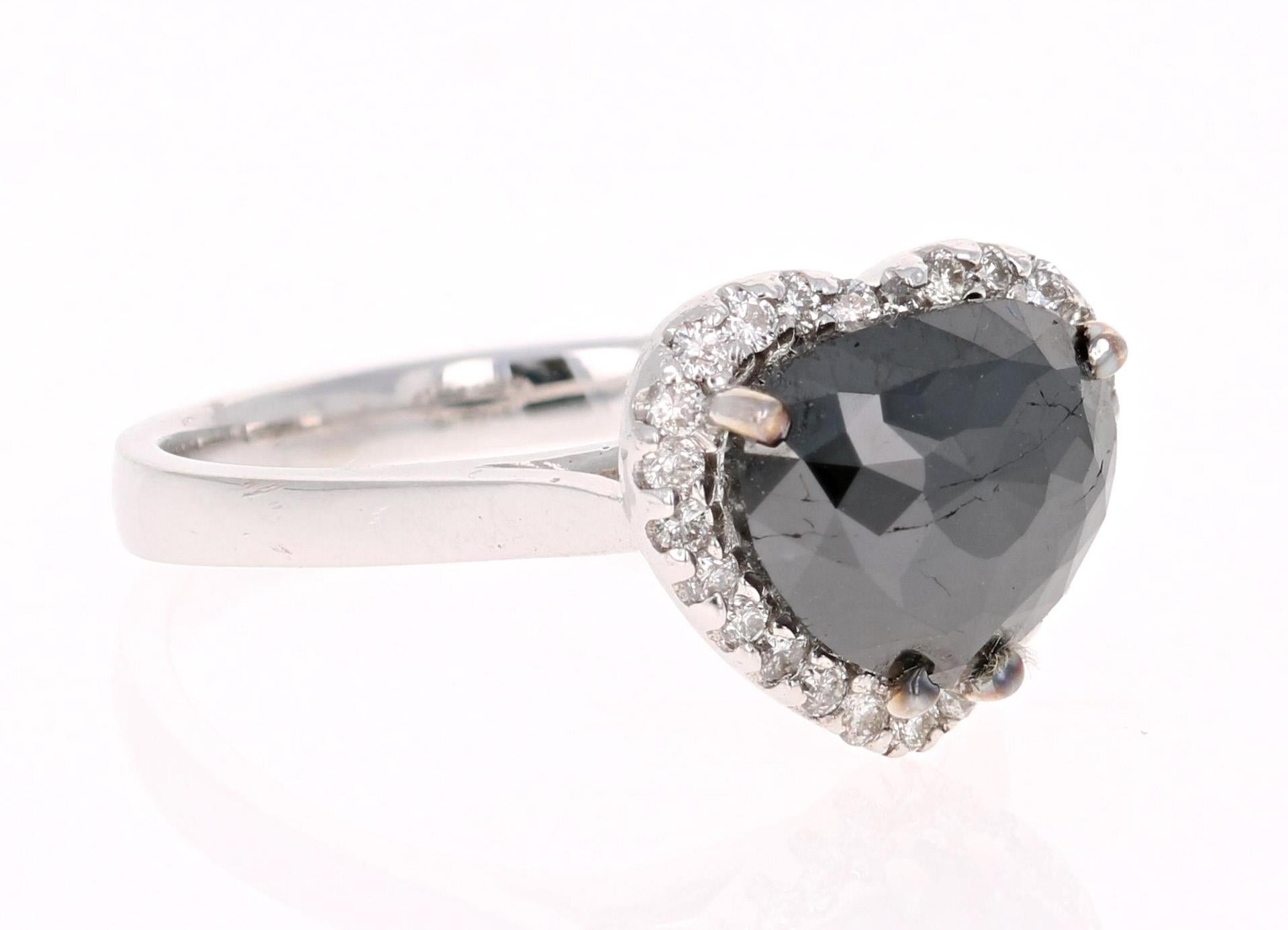 BOLD, ELEGANT and BEAUTIFULLY UNIQUE!

A 2.34 Carat Black Diamond White Gold Cocktail or Fashion Ring! Can also be used as a very unique and rare Engagement or Bridal Ring!  

A 2.07 Carat Rounded Heart Cut Black Diamond sits in the center and is