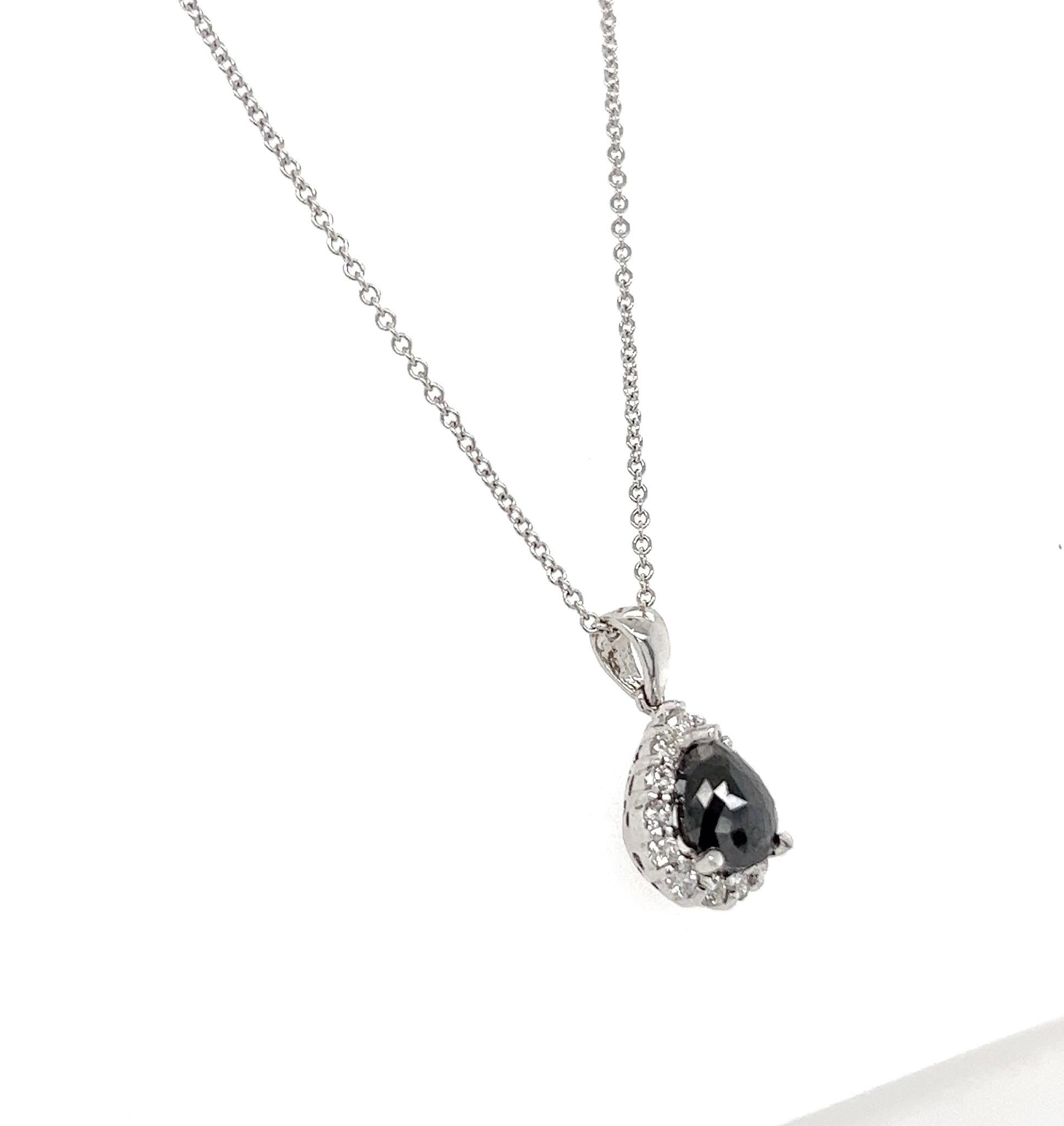 This beautiful chain necklace has a Natural Pear Cut Black Diamond that weighs 2.02 carats and also Natural Round Cut White Diamonds that weigh 0.32 carats. (Clarity: VS, Color: H)
The total carat weight of the necklace is 2.34 carats. 

The