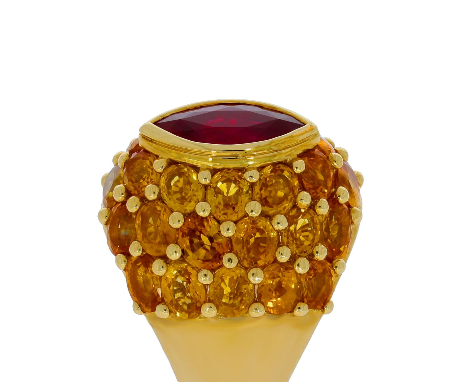 Selected for its rich saturated color, this marquise ruby weighs 2.34 carats, and is surrounded by 12.15 carats of yellow sapphires embedded in 18 carat yellow gold for a unique pop of color.