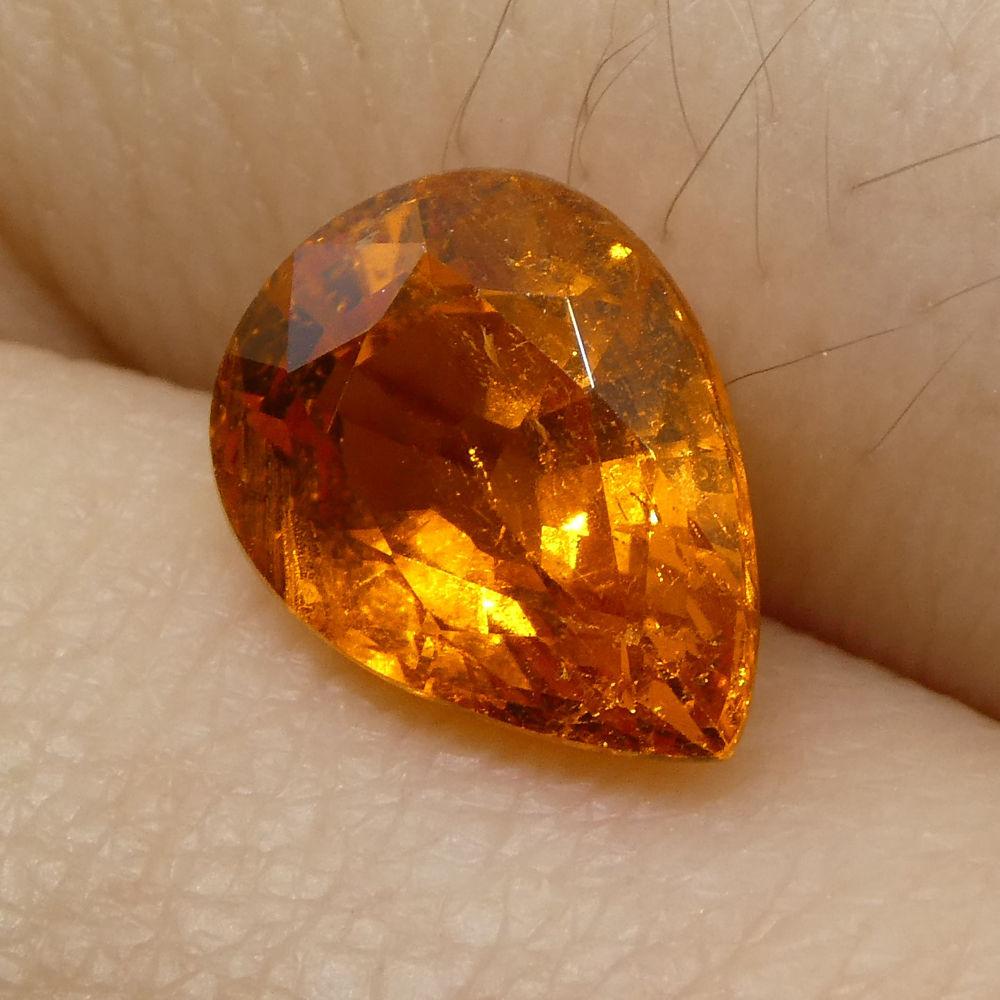 
Description:

Gem Type: Spessartite Garnet
Number of Stones: 1
Weight: 2.34 cts
Measurements: 8.75x6.59x4.68 mm
Shape: Pear Shape
Cutting Style Crown: Modified Brilliant Cut
Cutting Style Pavilion: Step Cut
Transparency: Transparent
Clarity: Very