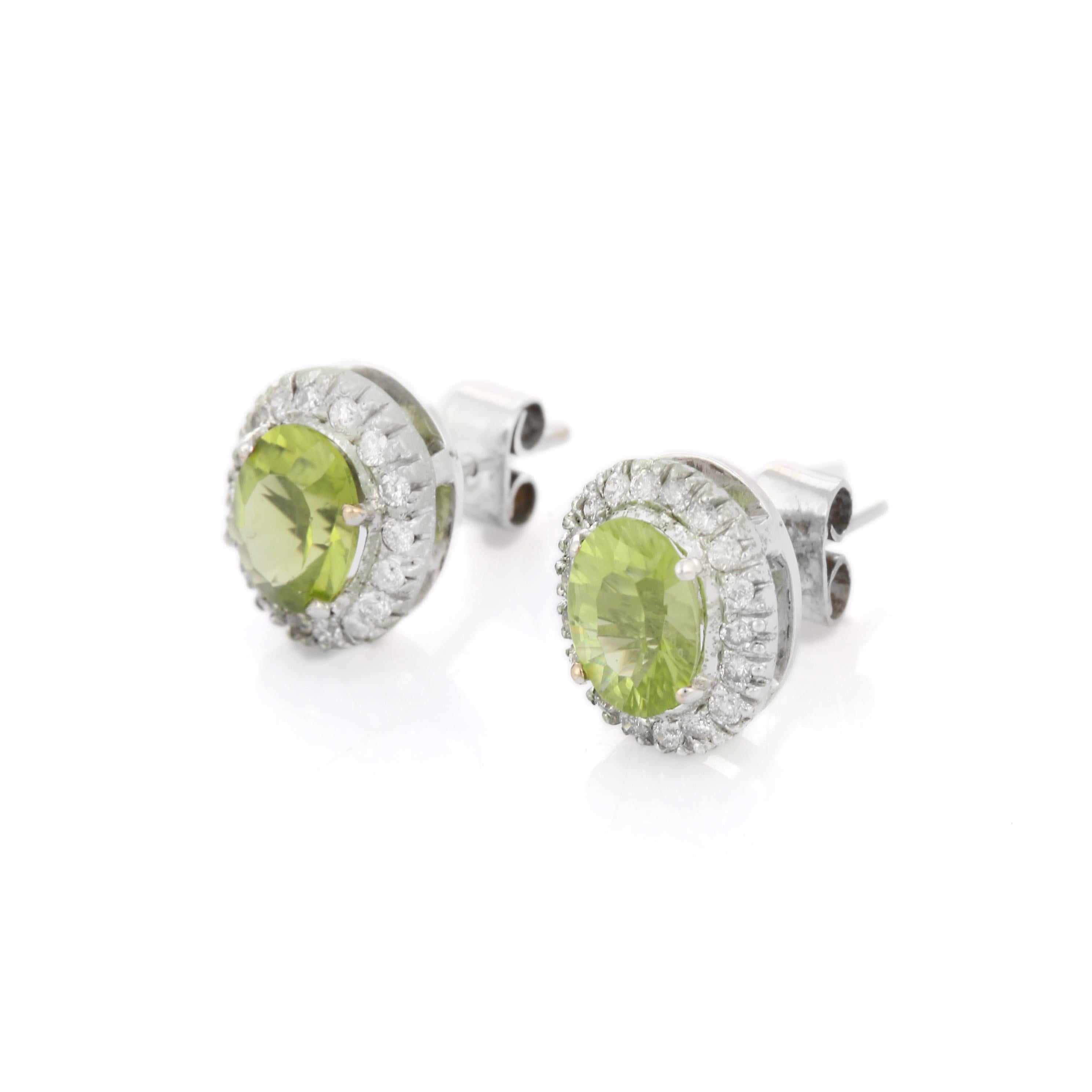 Studs create a subtle beauty while showcasing the colors of the natural precious gemstones and illuminating diamonds making a statement.

Oval cut peridot studs with diamonds in 18K gold. Embrace your look with these stunning pair of earrings