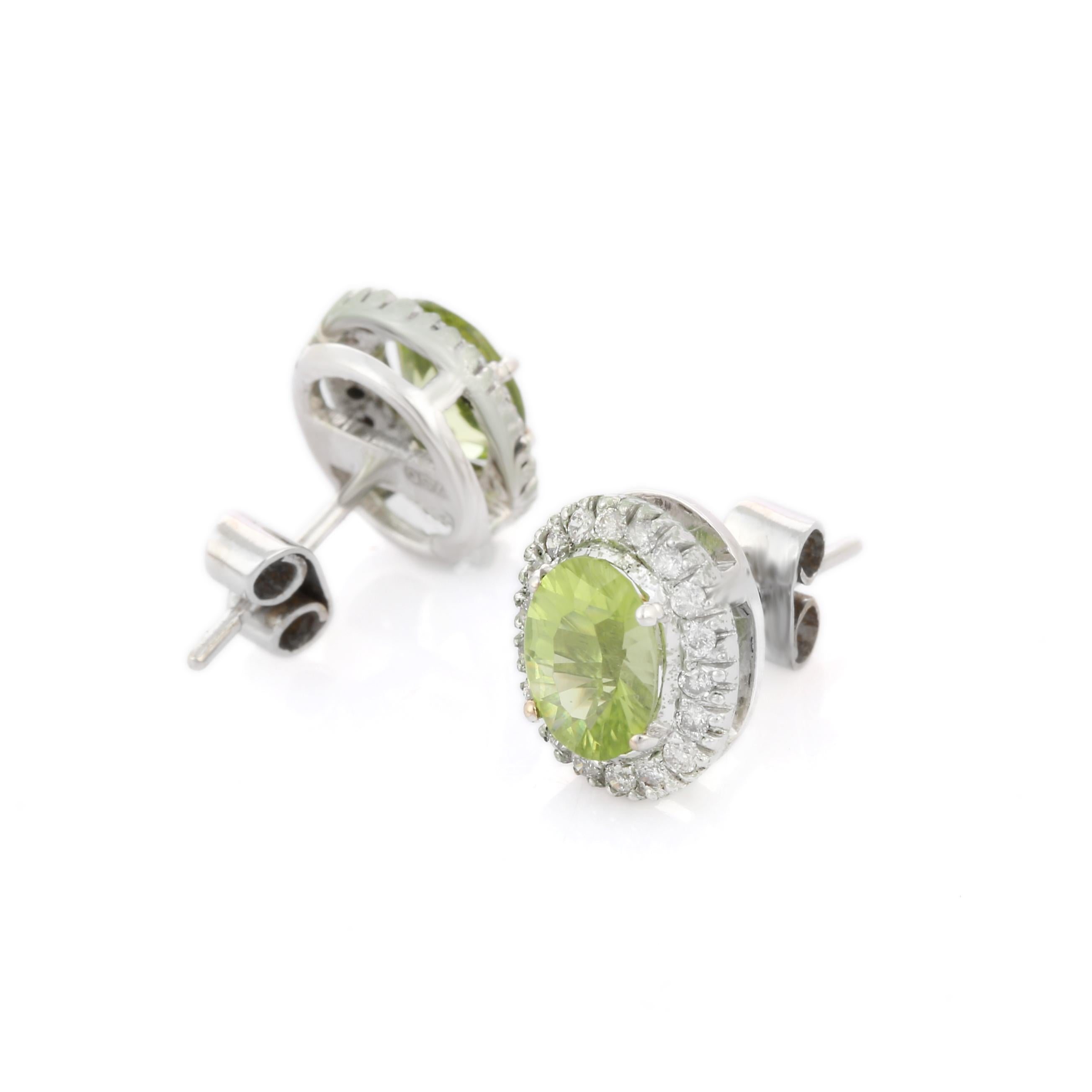 Modern 2.34 Ct Peridot with Halo Diamond Stud Earrings in 18K White Gold For Sale