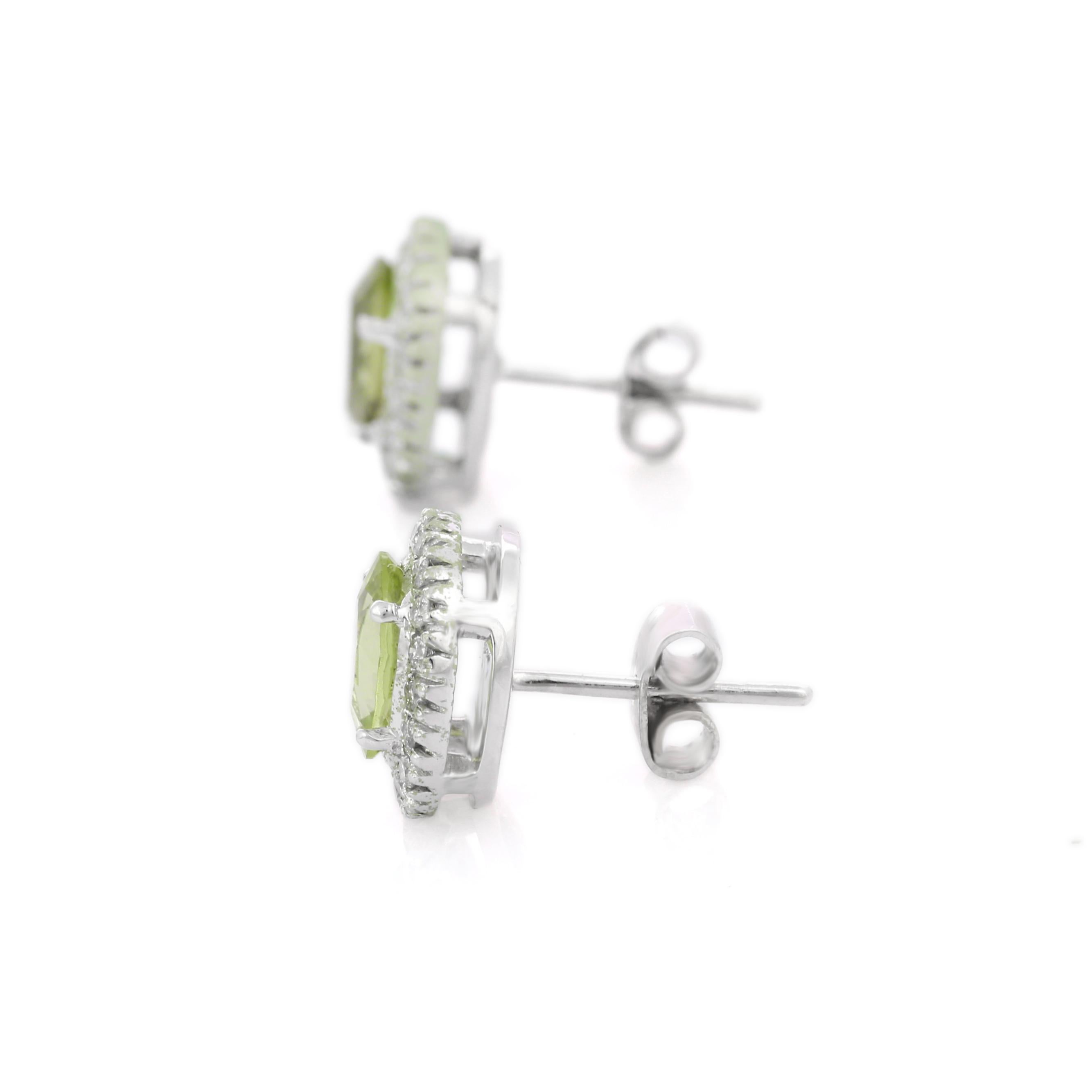 Oval Cut 2.34 Ct Peridot with Halo Diamond Stud Earrings in 18K White Gold For Sale