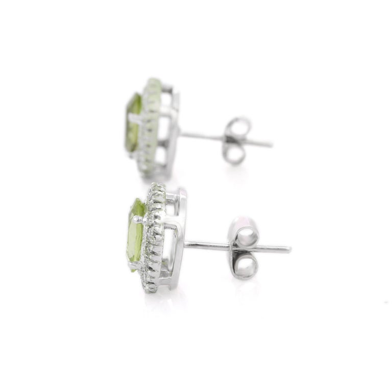 Oval Cut 2.34 Ct Peridot and Diamond Stud Earrings in 18K White Gold For Sale