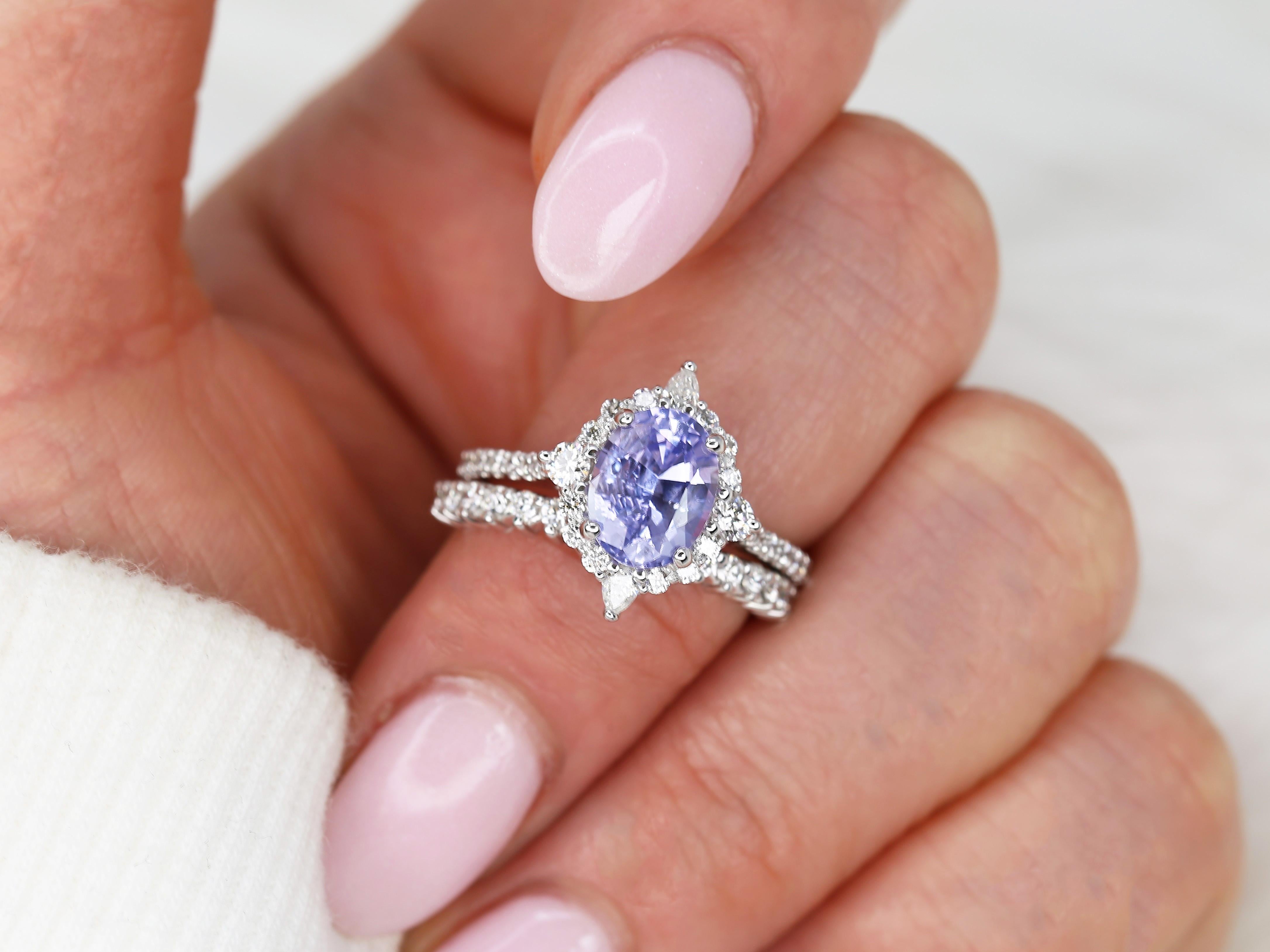 Elevate your style with our unique Lavender Sapphire Halo Ring and Diamond Matching Band. Handmade in Chicago with fair trade sapphire and conflict-free diamonds, expertly set by artisans with 15+ years of experience.

Details of Ring:

Engagement