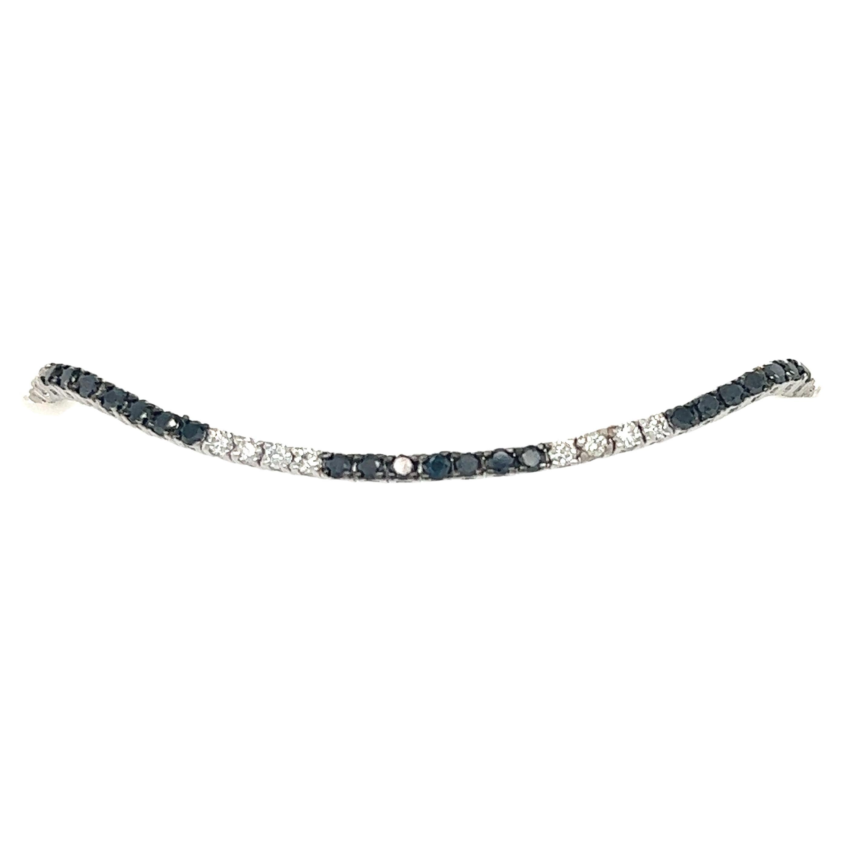 This bracelet has Natural Round Cut Black Diamonds that weigh 1.56 carats and Natural Round Cut White Diamonds that weigh 0.79 carats, (Clarity: SI, Color: F) The total carat weight of the bracelet is 2.35 carats. 

It is set in 14 Karat White Gold