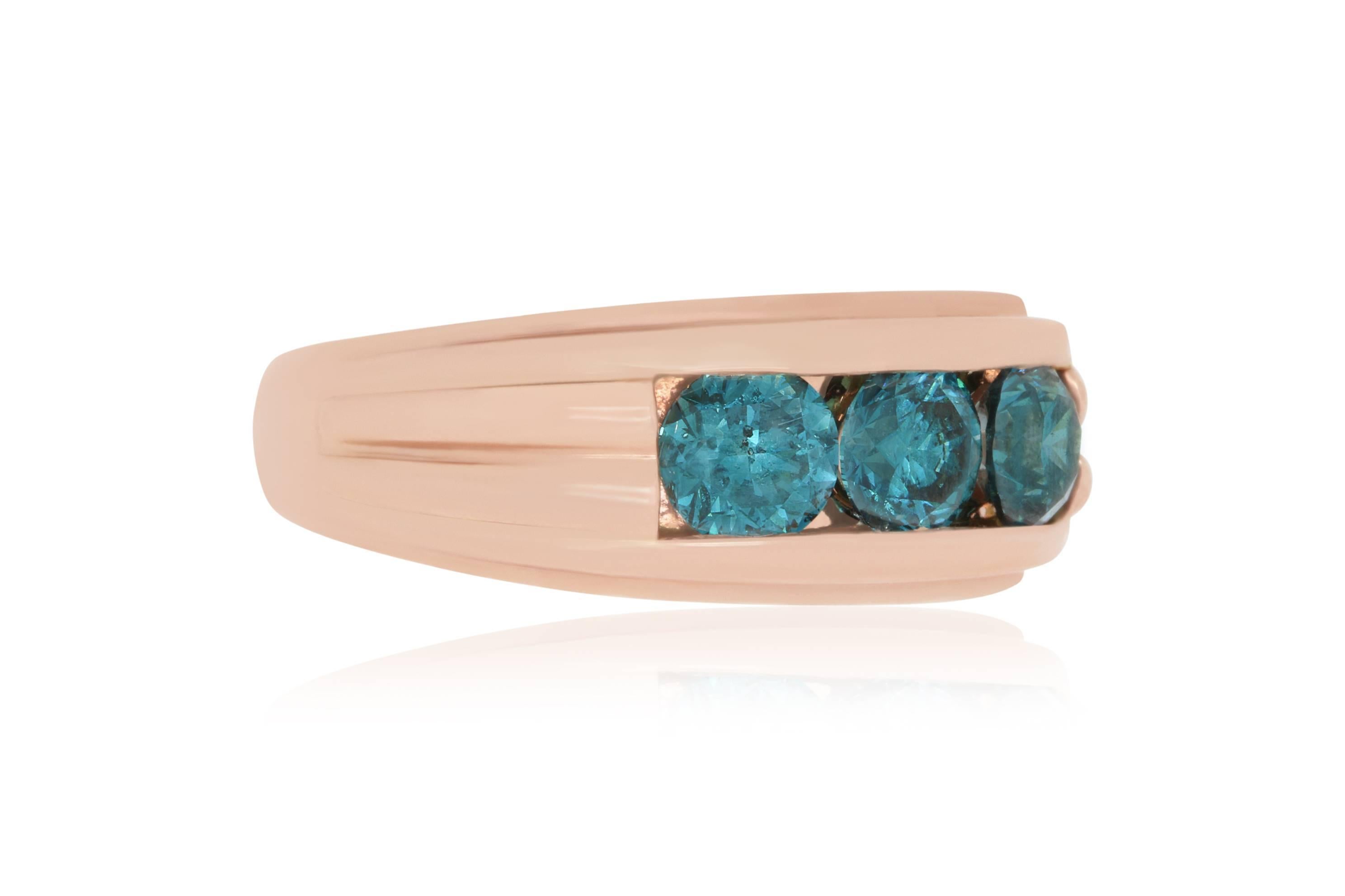 This band is a simple stunner.  A single row of 3 massive and stunning Blue Diamonds line the top of the band.  The Blue Diamonds really pop on the Rose Gold colored band.  

Material: 14k Rose Gold
Colored Diamond:: 3 Round Blue Diamonds at 2.35