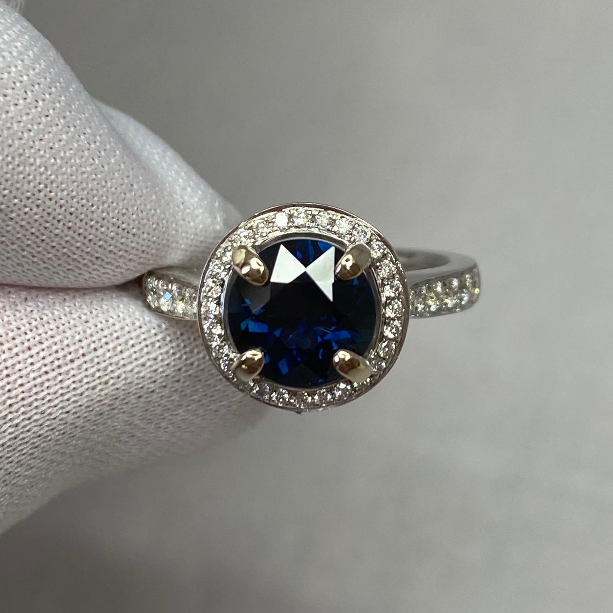 Stunning natural deep blue sapphire set in a fine 18k white gold diamond halo ring.
2.00 carat centre sapphire with a beautiful deep blue colour and excellent clarity. Australian in origin.

The sapphire has an excellent quality cut and polish,