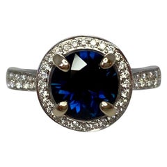 2.35 Carat Deep Blue Sapphire and Diamond 18 Karat Gold Halo Ring Round Cut