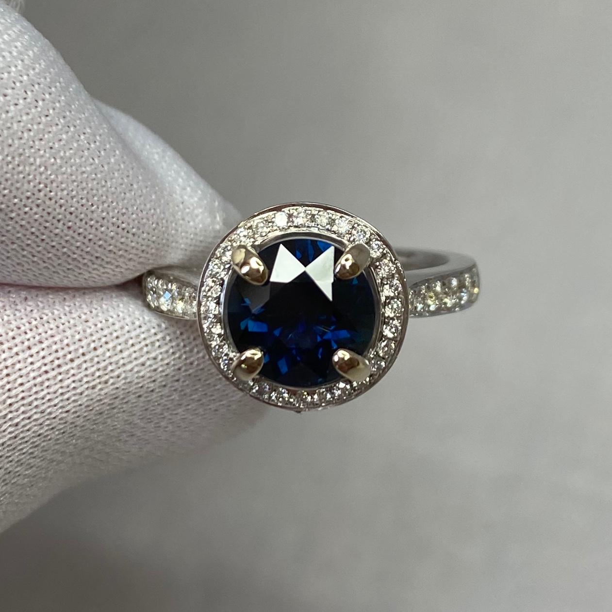 Natural Deep Blue Australian Sapphire & Diamond 18k White Gold Halo Ring.

Stunning deep blue sapphire set in a fine 18k white gold diamond halo ring.

2.00 carat centre sapphire with a beautiful deep blue colour and excellent clarity. Australian in