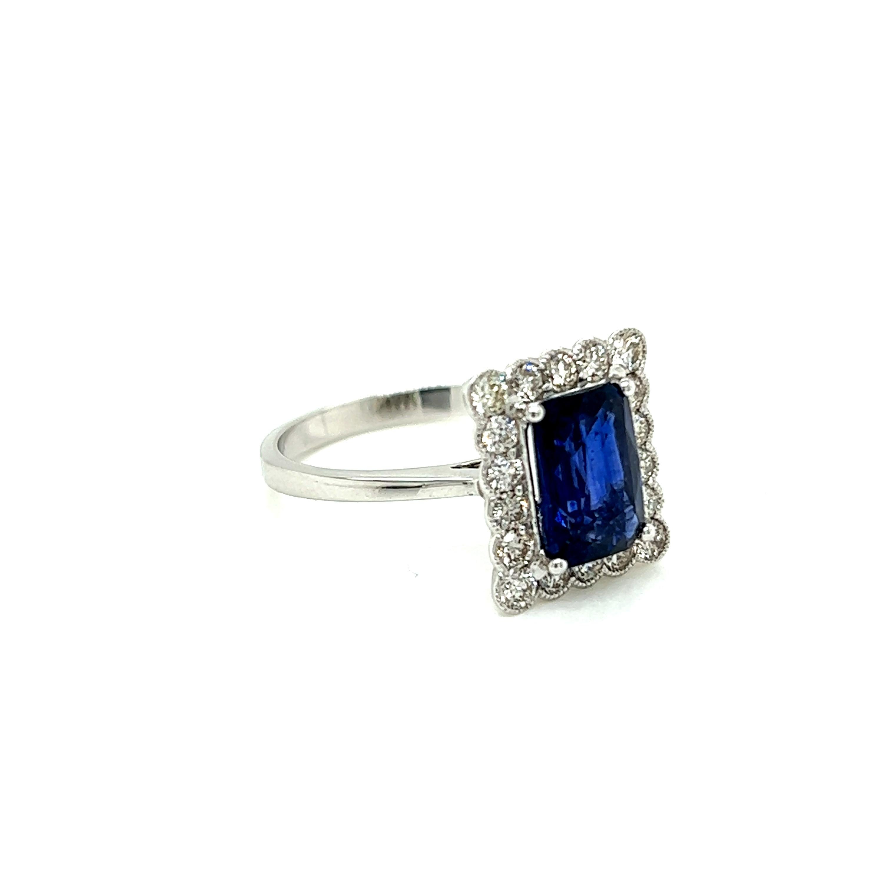 2.35 Carat Emerald cut Blue Sapphire and Diamond Cluster Ring in 18K White Gold In New Condition For Sale In London, GB