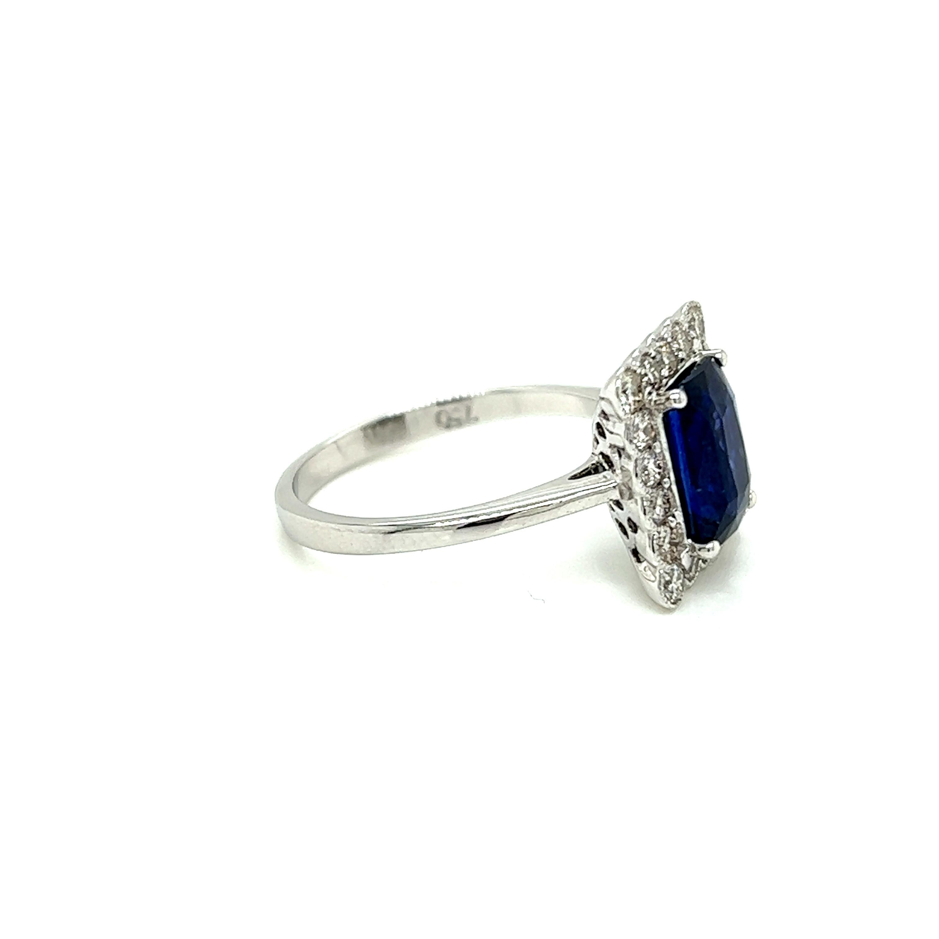 Women's 2.35 Carat Emerald cut Blue Sapphire and Diamond Cluster Ring in 18K White Gold For Sale