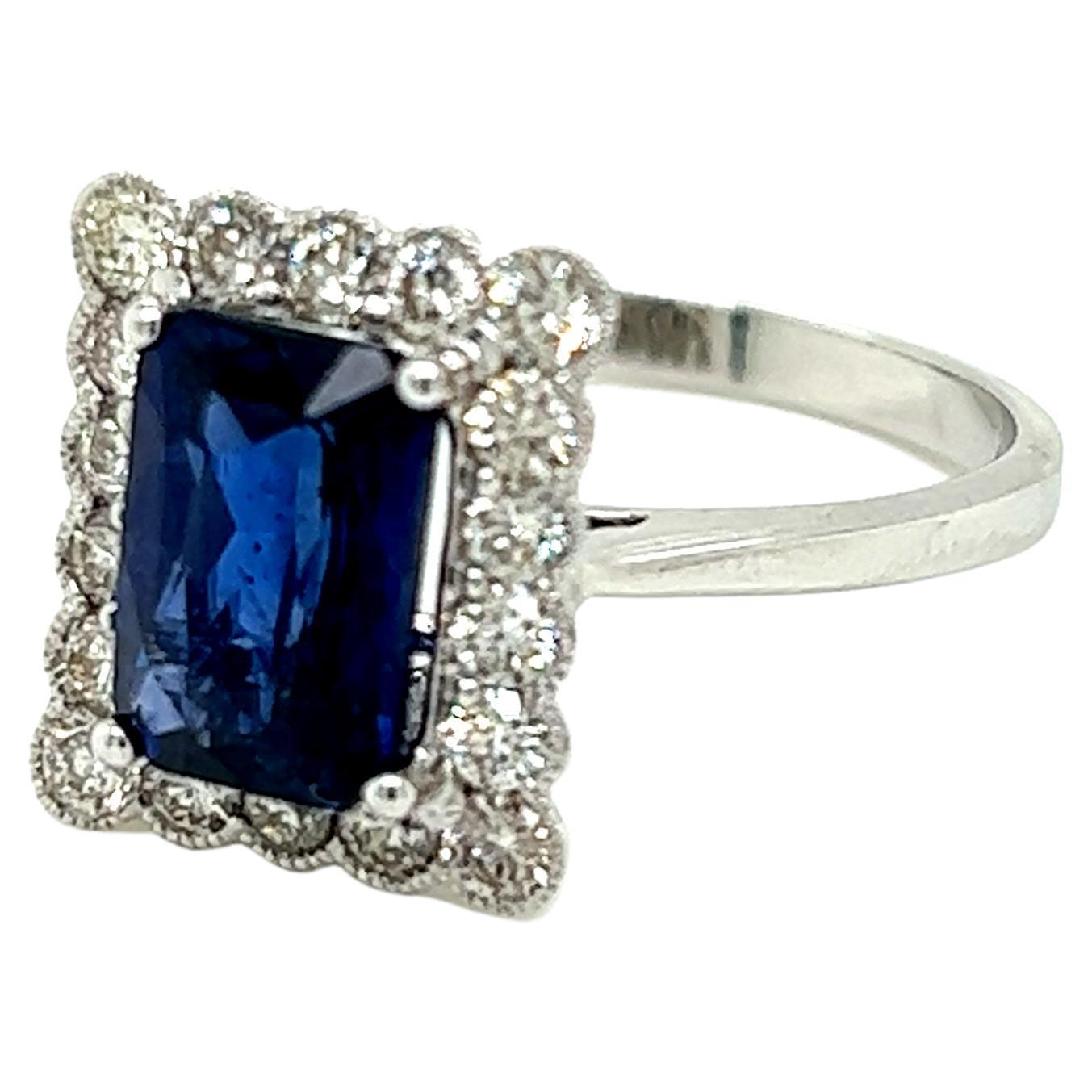 2.35 Carat Emerald cut Blue Sapphire and Diamond Cluster Ring in 18K White Gold