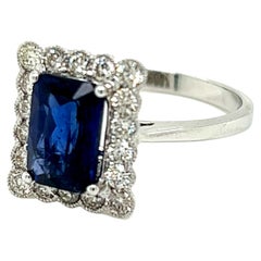 2.35 Carat Emerald cut Blue Sapphire and Diamond Cluster Ring in 18K White Gold