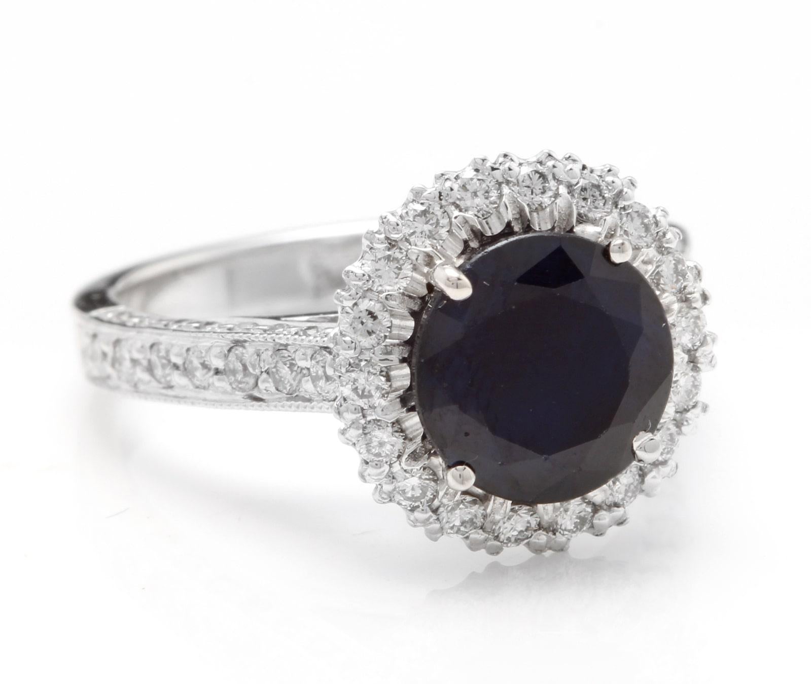 2.35 Carats Exquisite Natural Blue Sapphire and Diamond 14K Solid White Gold Ring

Total Natural Blue Sapphire Weight is: Approx. 1.65 Carats

Sapphire Measures: Approx. 8.00mm

Sapphire Treatment: (Diffusion)

Natural Round Diamonds Weight: Approx.