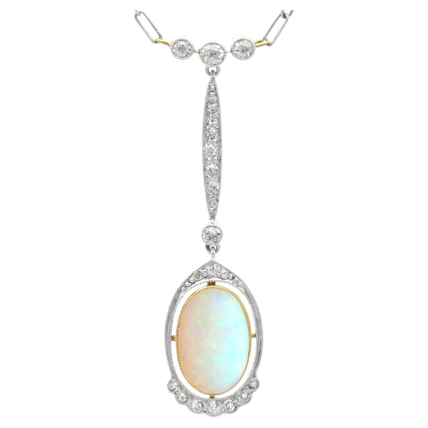 2.35 Carat Opal and 0.60 Carat Diamond, 18 Karat Yellow Gold Pendant Circa 1920