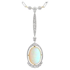 2.35 Carat Opal and 0.60 Carat Diamond, 18 Karat Yellow Gold Pendant Circa 1920