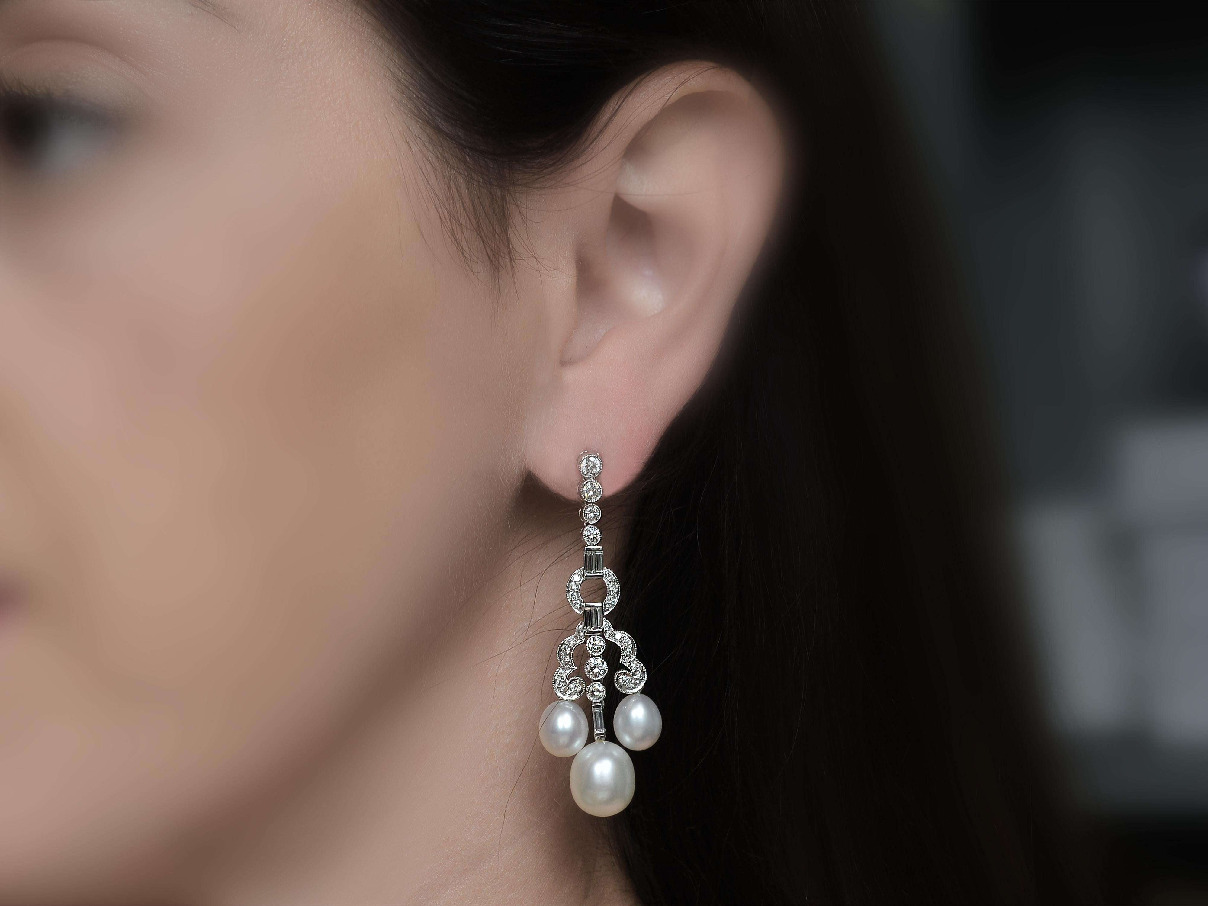 These Elegant Platinum Pearl Drop Earrings Are Accented with 65 Round Diamonds & 10 Baguette Diamonds of SI Clarity & G Color. All Diamonds Total 2.35 Carats. The Chandelier Terminates with Four Oval Cultured Pearls Measuring 7.5 Millimeters & Two