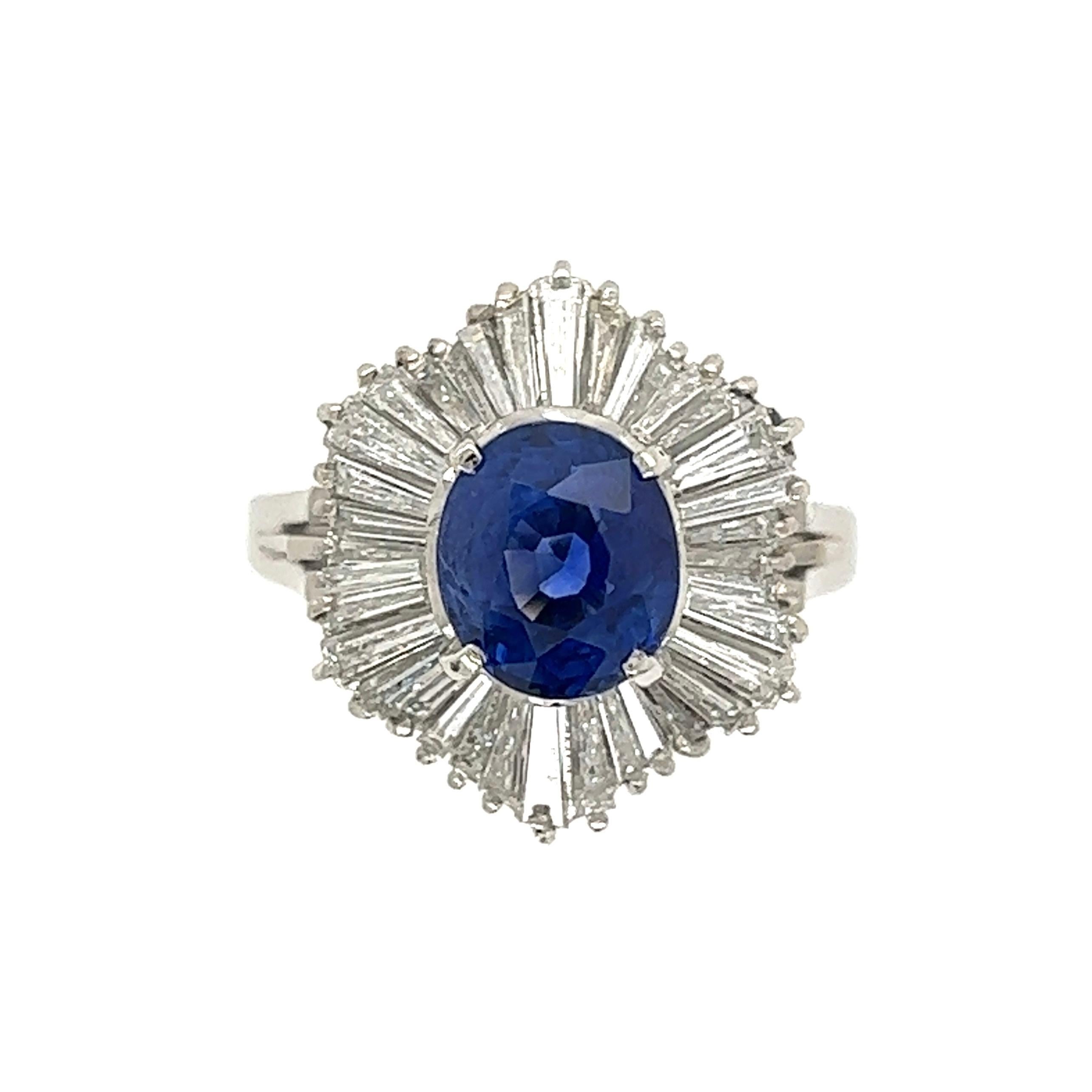 Simply Beautiful! Finely crafted Blue Sapphire Cocktail ring, center securely set with a 2.35 Carat Sapphire, surrounded by Baguette Diamonds, H color, VS/SI (clean and white!), weighing approx. 1.18tcw. Hand crafted Platinum mounting. Approx.